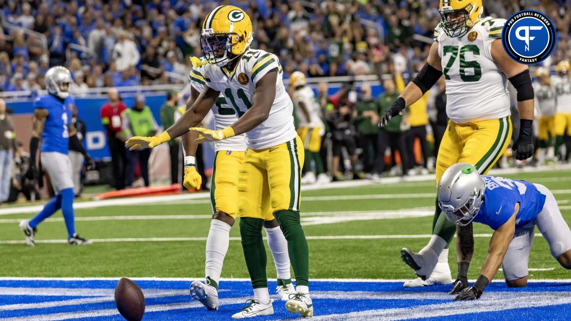 Green Bay Packers wide receiver Jayden Reed (11) scores a touchdown in the first quarter against the Detroit Lions during the annual Thanksgiving Day game at Ford Field.