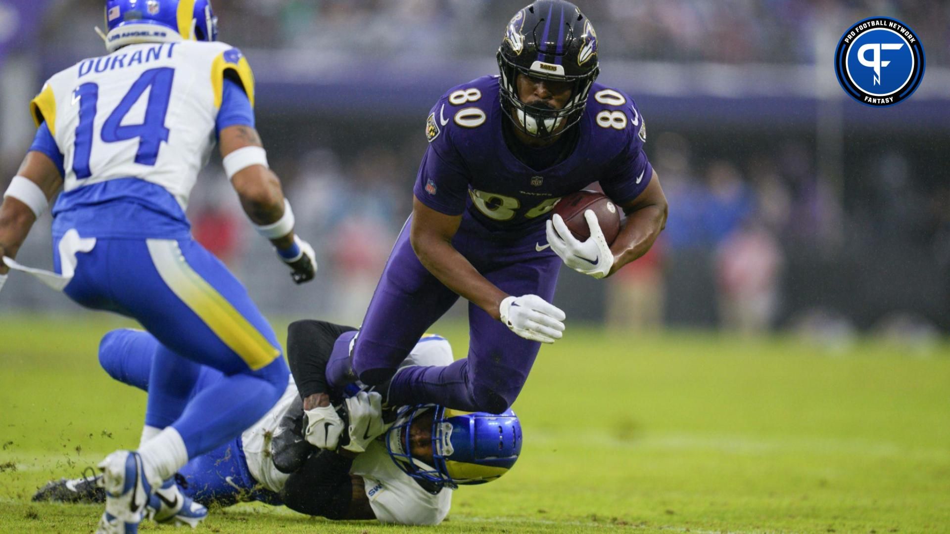 Baltimore Ravens tight end Isaiah Likely (80) is tackled by Los Angeles Rams safety John Johnson III (43) during the second quarter at M&T Bank Stadium.