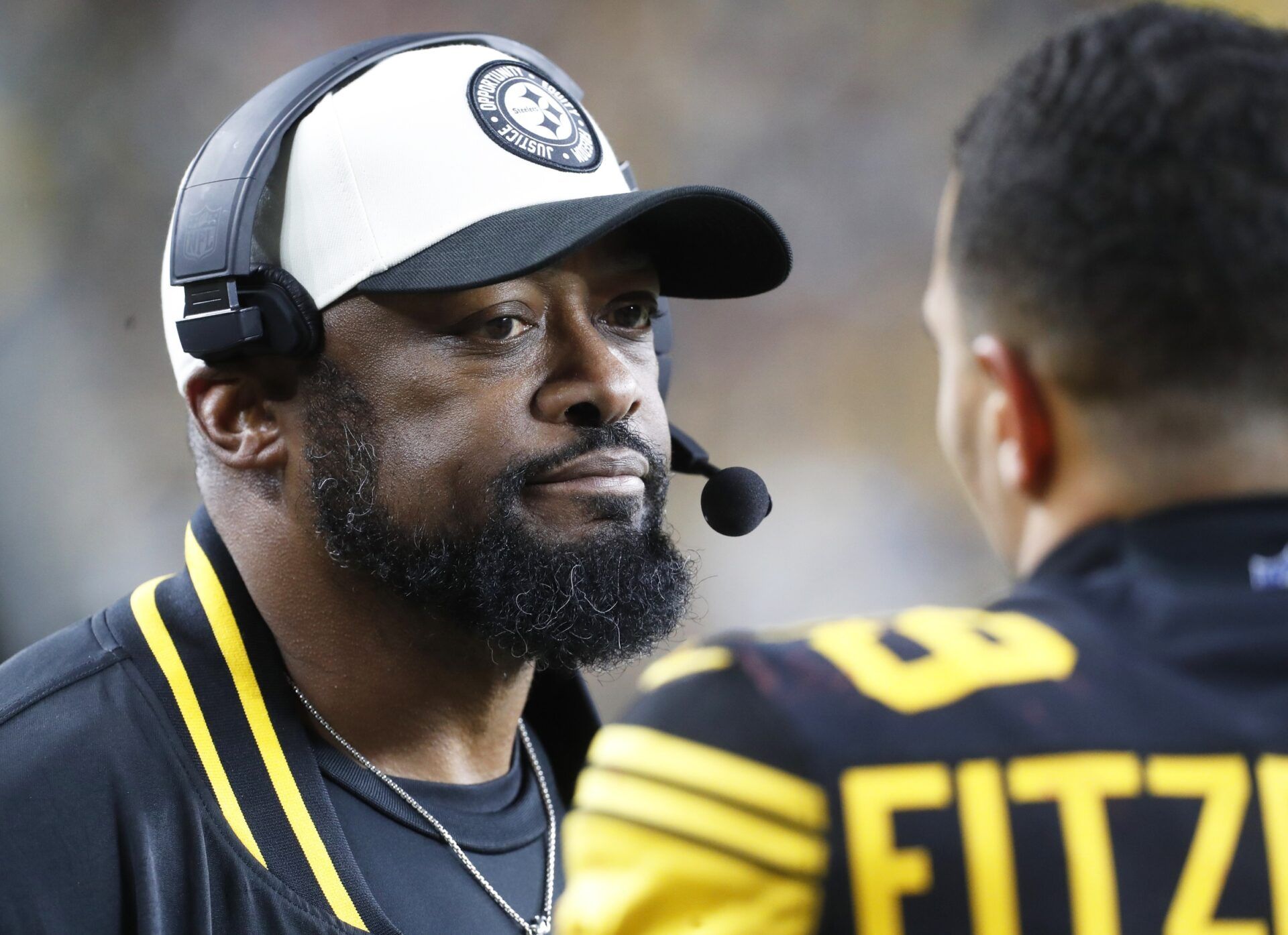 Pittsburgh Steelers head coach Mike Tomlin (left) reacts to safety Minkah Fitzpatrick (39) on the sidelines against the New England Patriots during the fourth quarter at Acrisure Stadium.