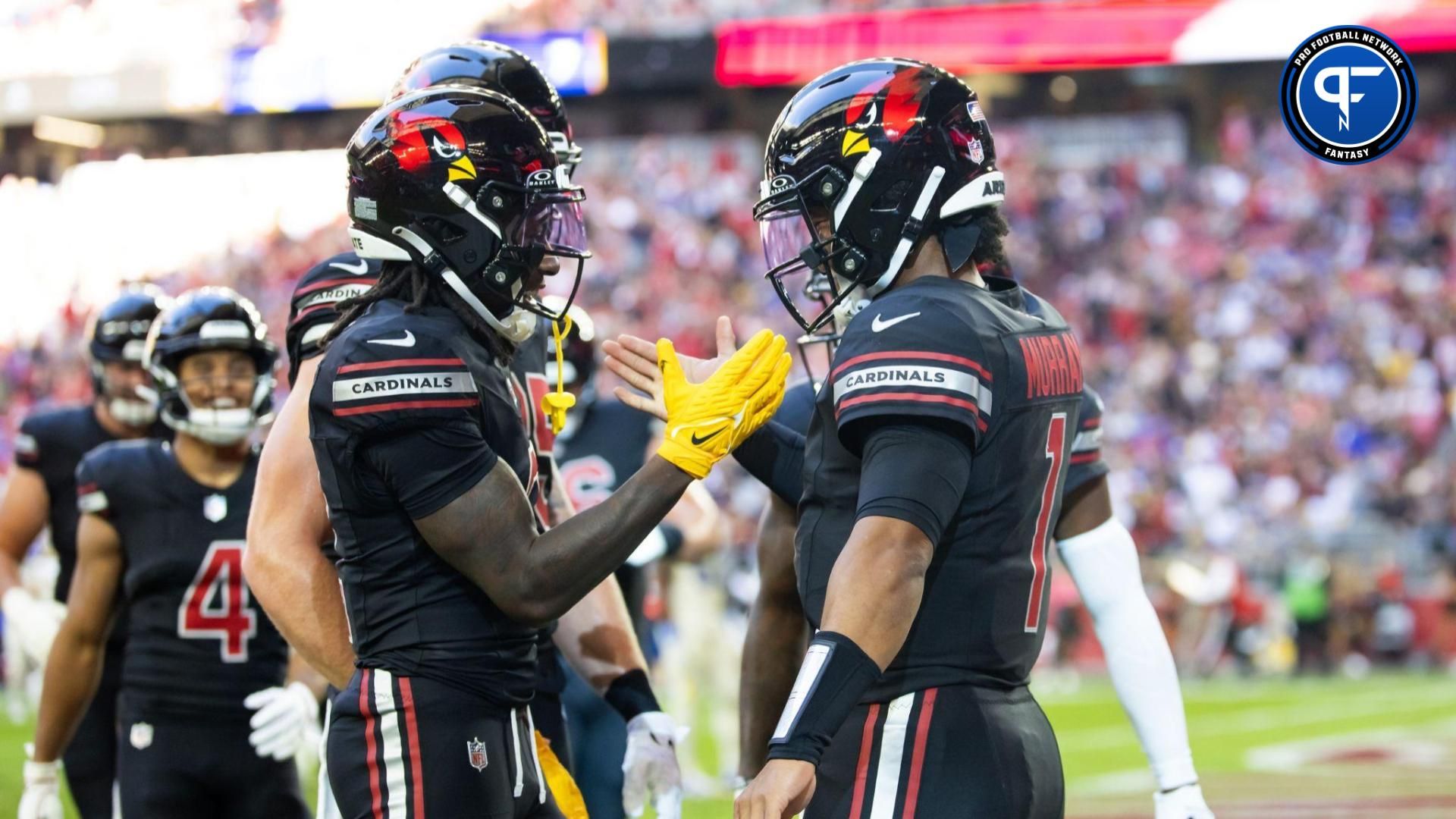 Arizona Cardinals quarterback Kyler Murray (right) celebrates a touchdown with wide receiver Marquise Brown against the Los Angeles Rams in the first half at State Farm Stadium.