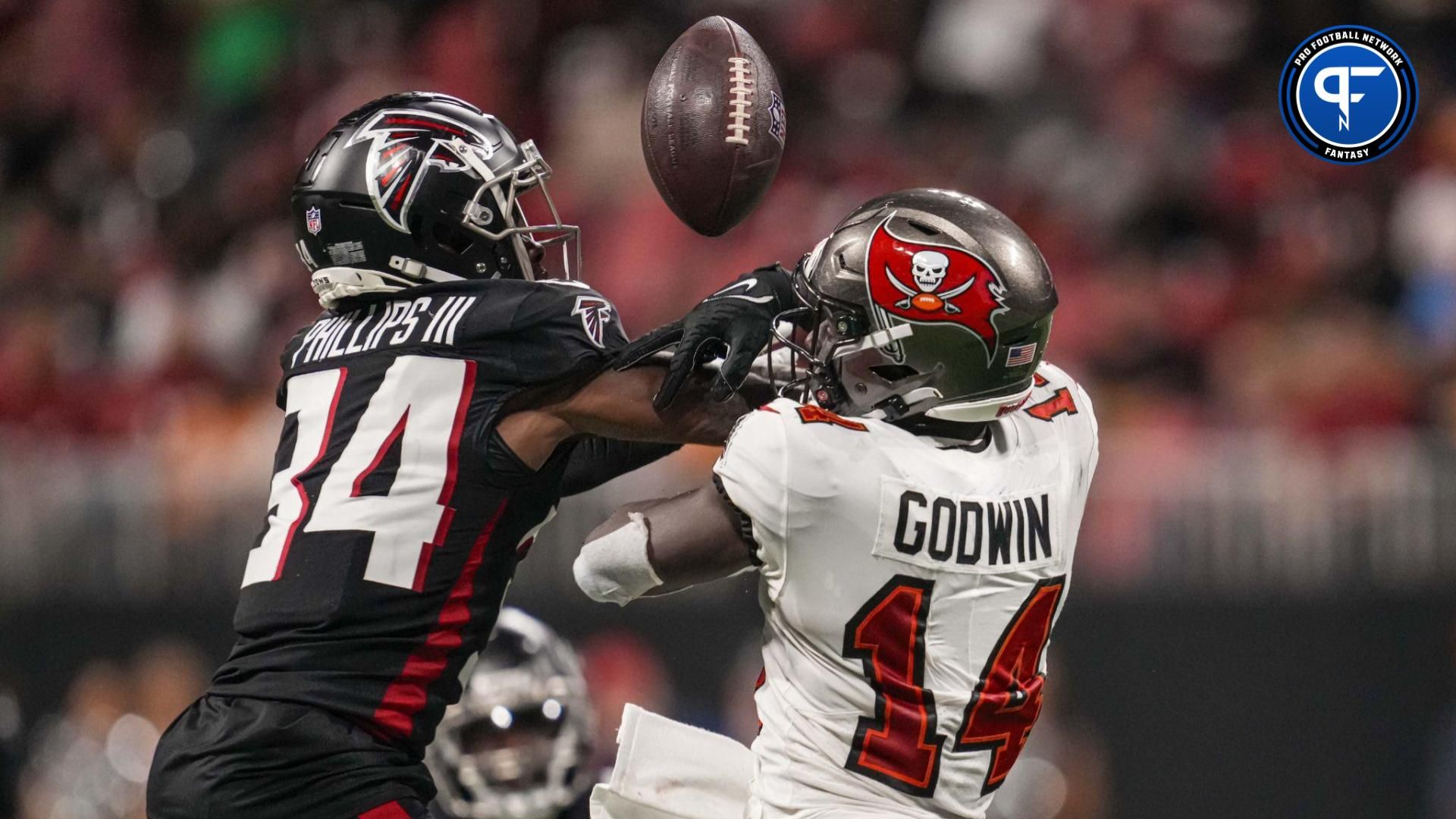 Atlanta Falcons cornerback Clark Phillips III (34) breaks up a pass against Tampa Bay Buccaneers wide receiver Chris Godwin (14) during the second half at Mercedes-Benz Stadium.