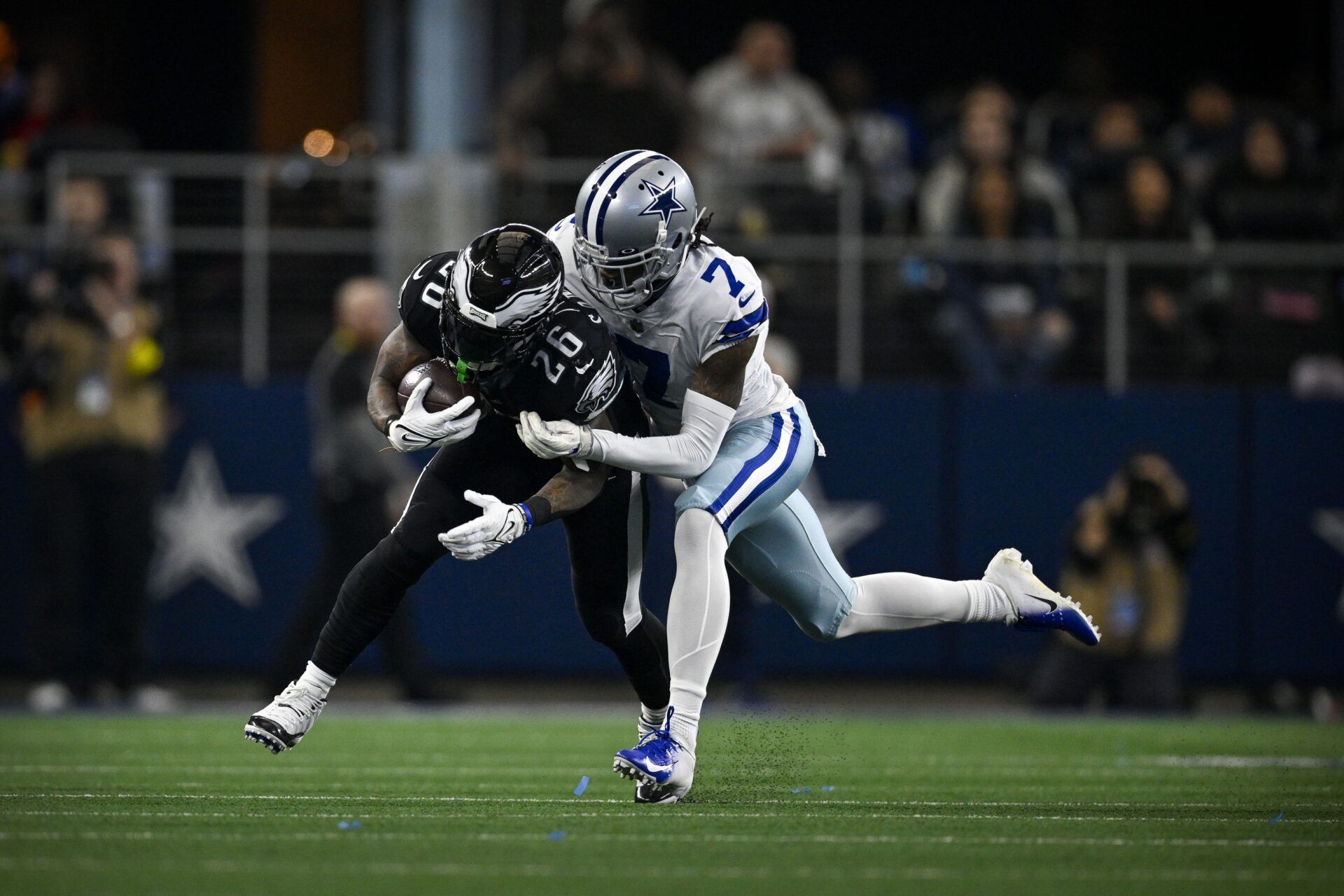 Dallas Cowboys CB Trevon Diggs (7) tackles Philadelphia Eagles RB Miles Sanders (26).