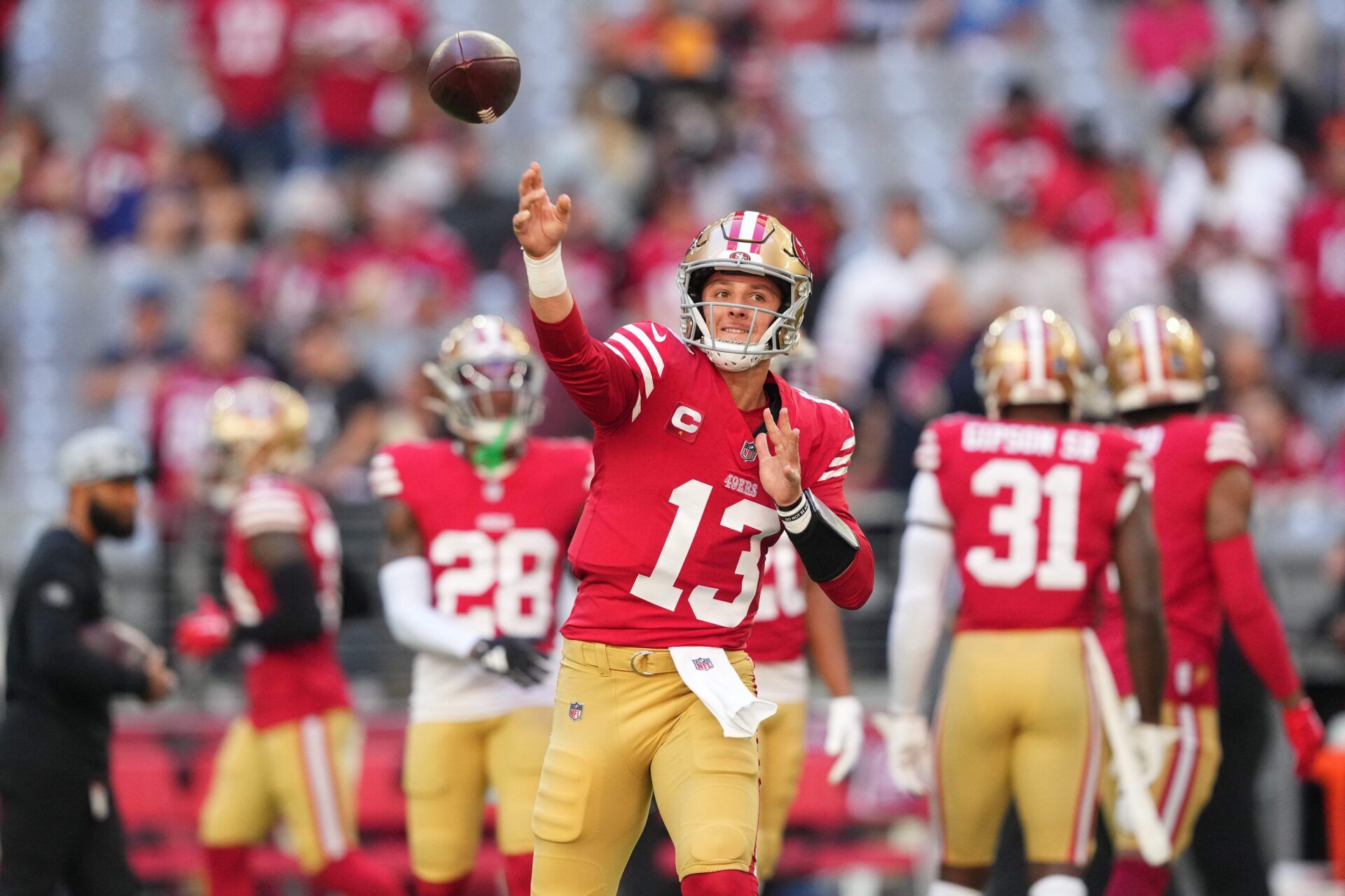 San Francisco 49ers quarterback Brock Purdy (13) warms up prior to facing the Arizona Cardinals at State Farm Stadium.