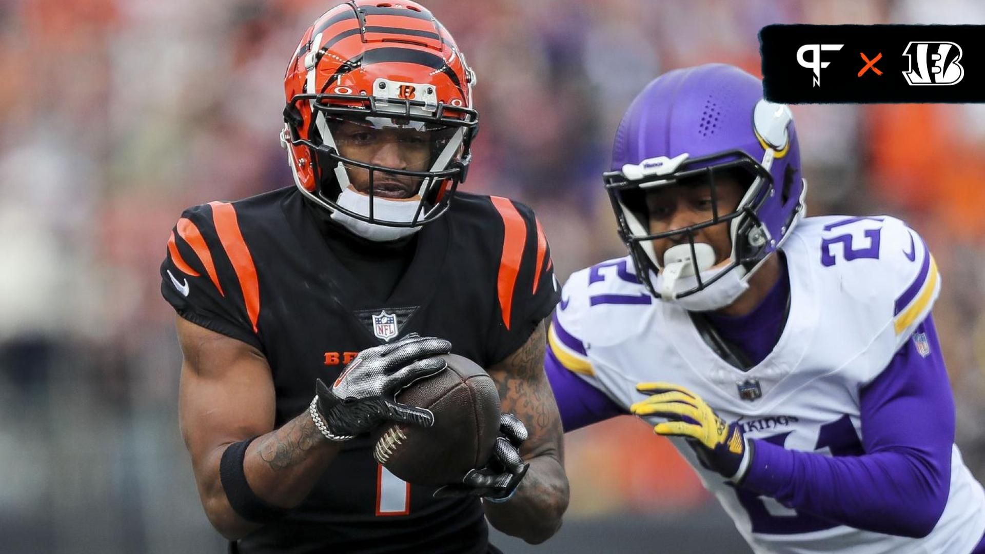 Cincinnati Bengals wide receiver Ja'Marr Chase (1) runs with the ball against Minnesota Vikings cornerback Akayleb Evans (21) in the first half at Paycor Stadium.