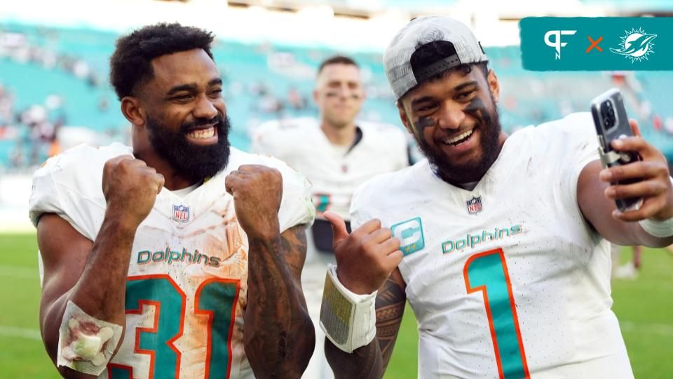 Miami Dolphins quarterback Tua Tagovailoa (1) and running back Raheem Mostert (31) celebrate after defeating the New York Jets at Hard Rock Stadium.