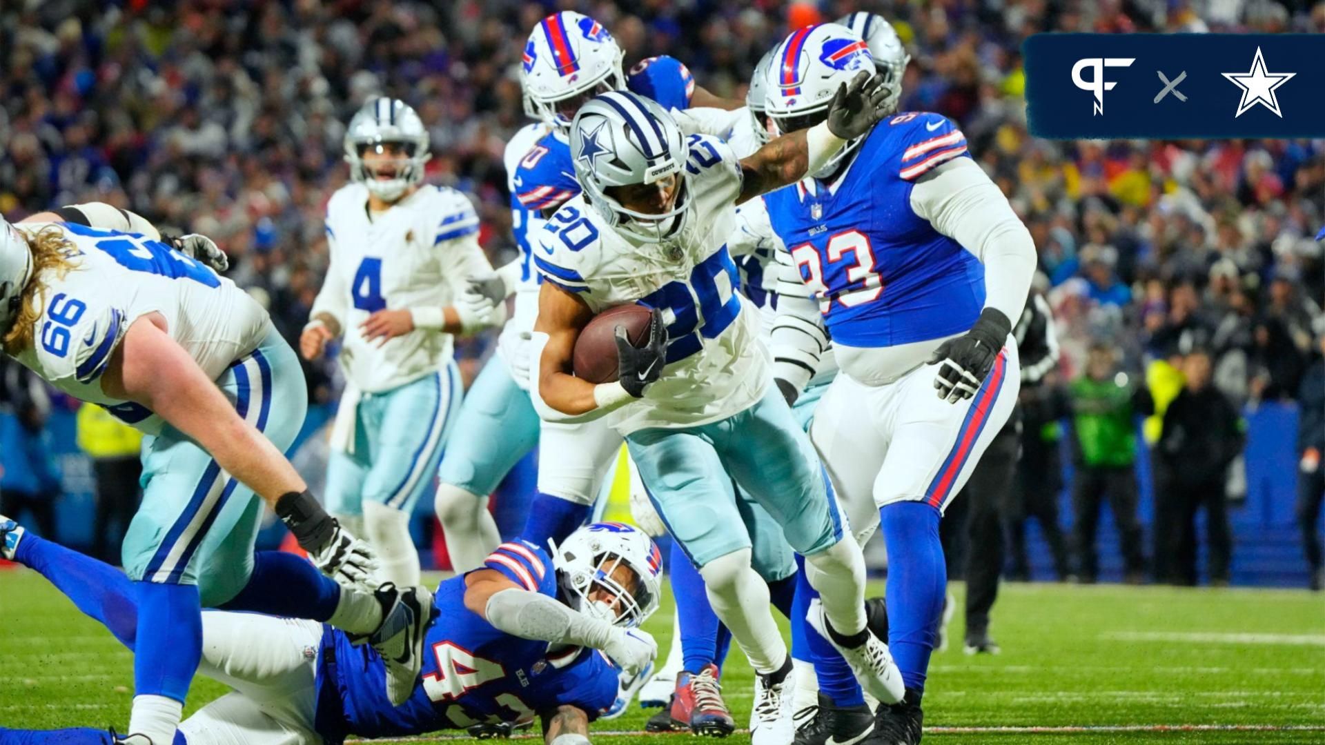 Dallas Cowboys running back Tony Pollard (20) beats a tackle attempt by Buffalo Bills cornerback Tre Norwood (38) in the first half in the first half at Highmark Stadium.