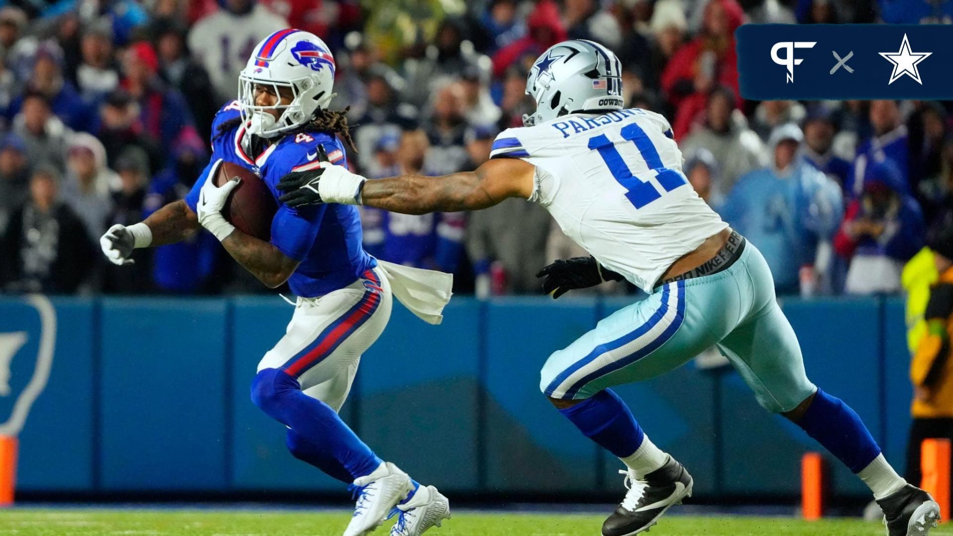 Buffalo Bills running back James Cook (4) runs the ball pressured by Dallas Cowboys linebacker Micah Parsons (11) in the second half at Highmark Stadium.