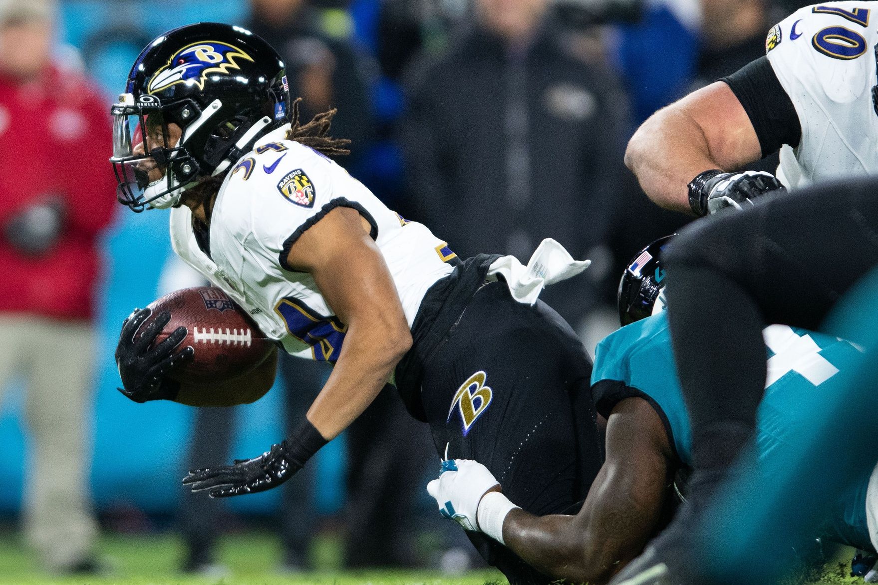 Jacksonville Jaguars linebacker Josh Allen (41) makes the tackle against Baltimore Ravens running back Keaton Mitchell (34) in the first quarter at EverBank Stadium.