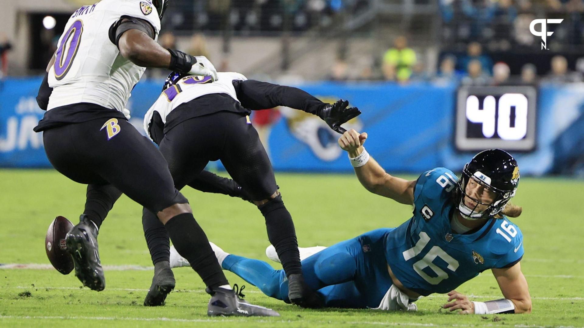 Jacksonville Jaguars quarterback Trevor Lawrence (16) fumbles the football during the second quarter of a regular season NFL football matchup Sunday, Dec. 17, 2023 at EverBank Stadium in Jacksonville, Fla.