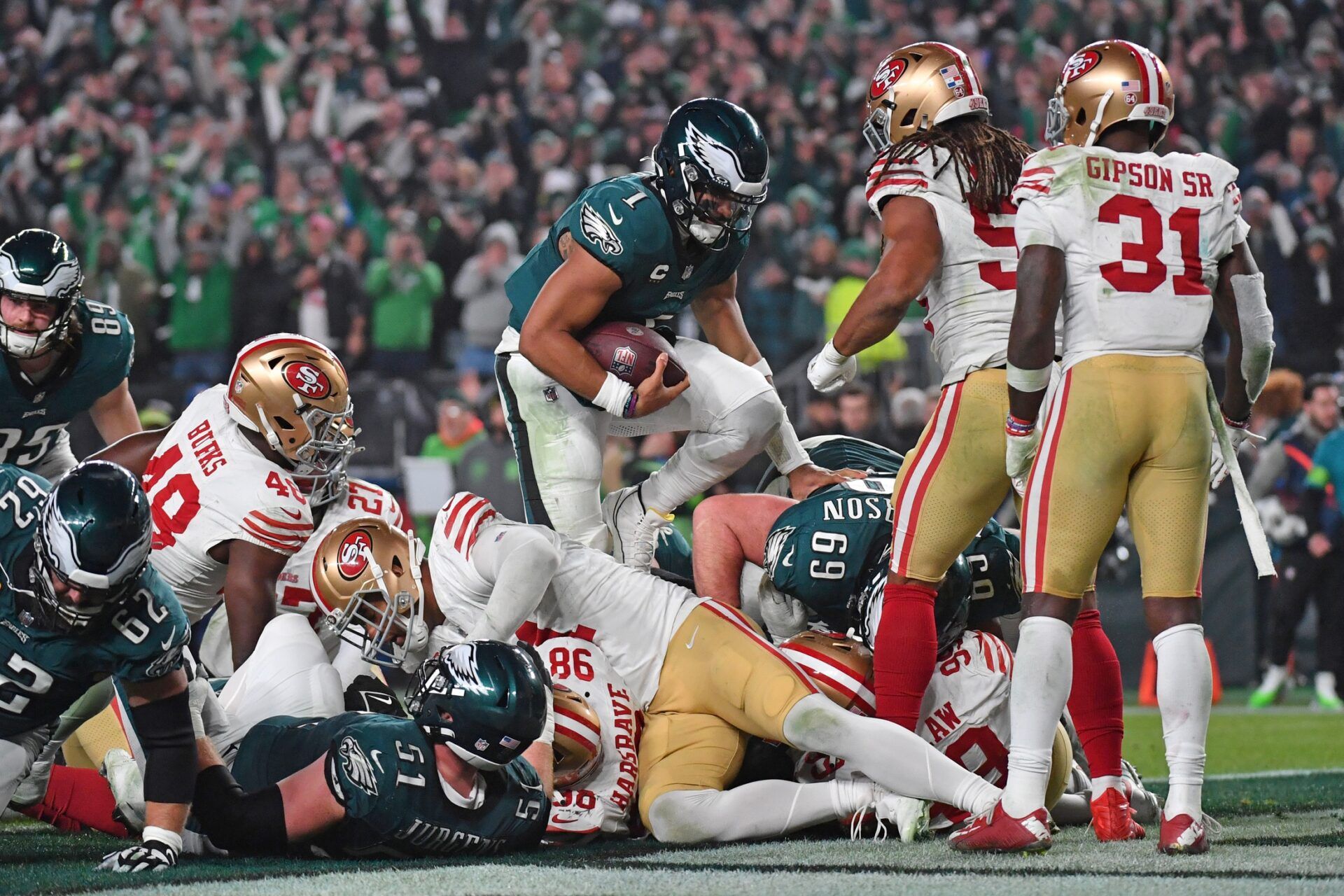 Philadelphia Eagles quarterback Jalen Hurts (1) scores a touchdown against the San Francisco 49ers during the third quarter at Lincoln Financial Field.