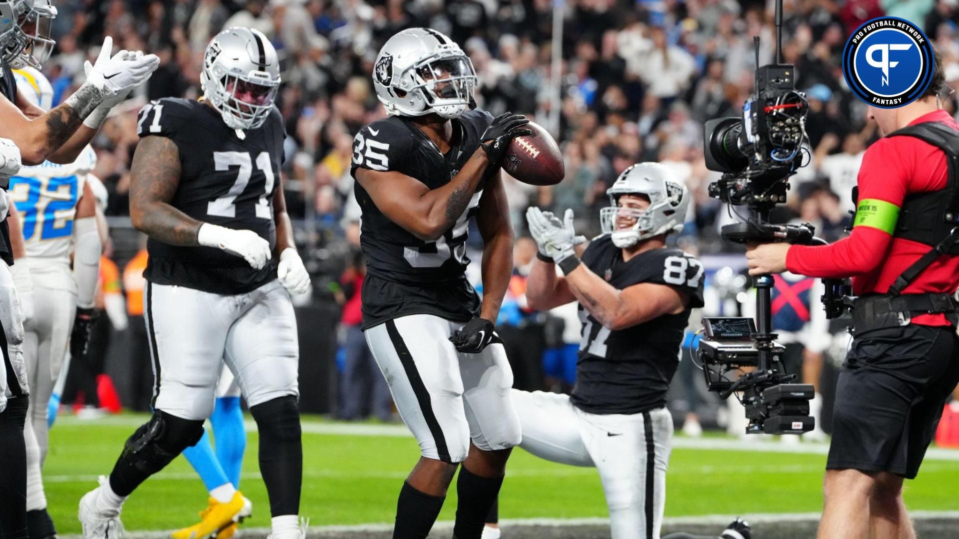 Las Vegas Raiders running back Zamir White (35) celebrates after scoring a touchdown against the Los Angeles Chargers in the first quarter at Allegiant Stadium.