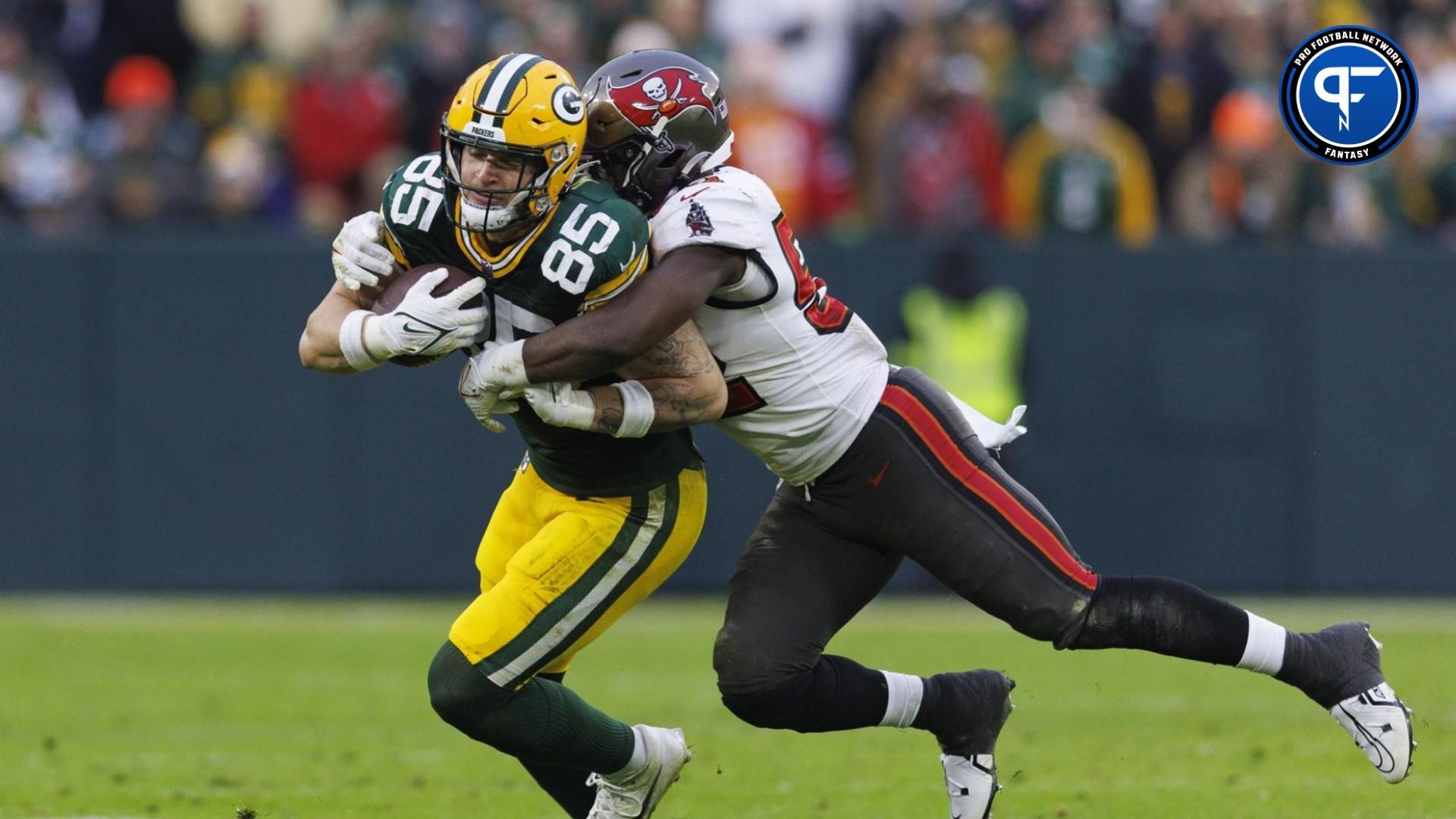 Green Bay Packers tight end Tucker Kraft (85) is tackled by Tampa Bay Buccaneers linebacker K.J. Britt (52) after catching a pass during the fourth quarter at Lambeau Field.