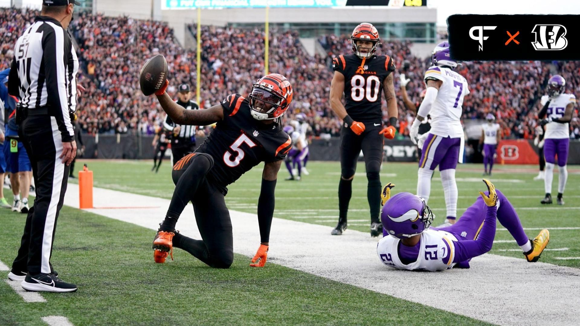 Cincinnati Bengals wide receiver Tee Higgins (5) gestures toward the official after catching a touchdown pass as Minnesota Vikings cornerback Akayleb Evans (21) defends in the fourth quarter at Paycor Stadium.