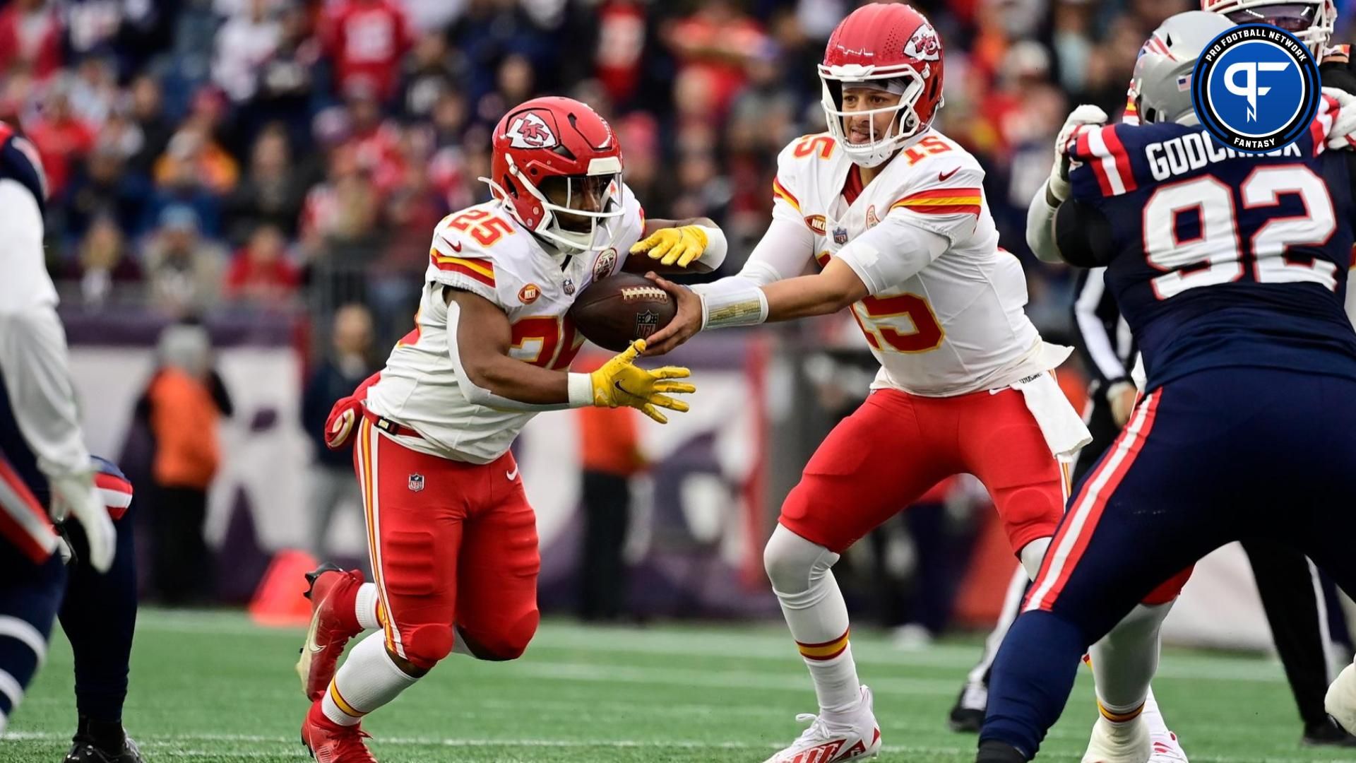 Kansas City Chiefs quarterback Patrick Mahomes (15) hands the ball off to running back Clyde Edwards-Helaire (25) during the first half against the New England Patriots at Gillette Stadium.