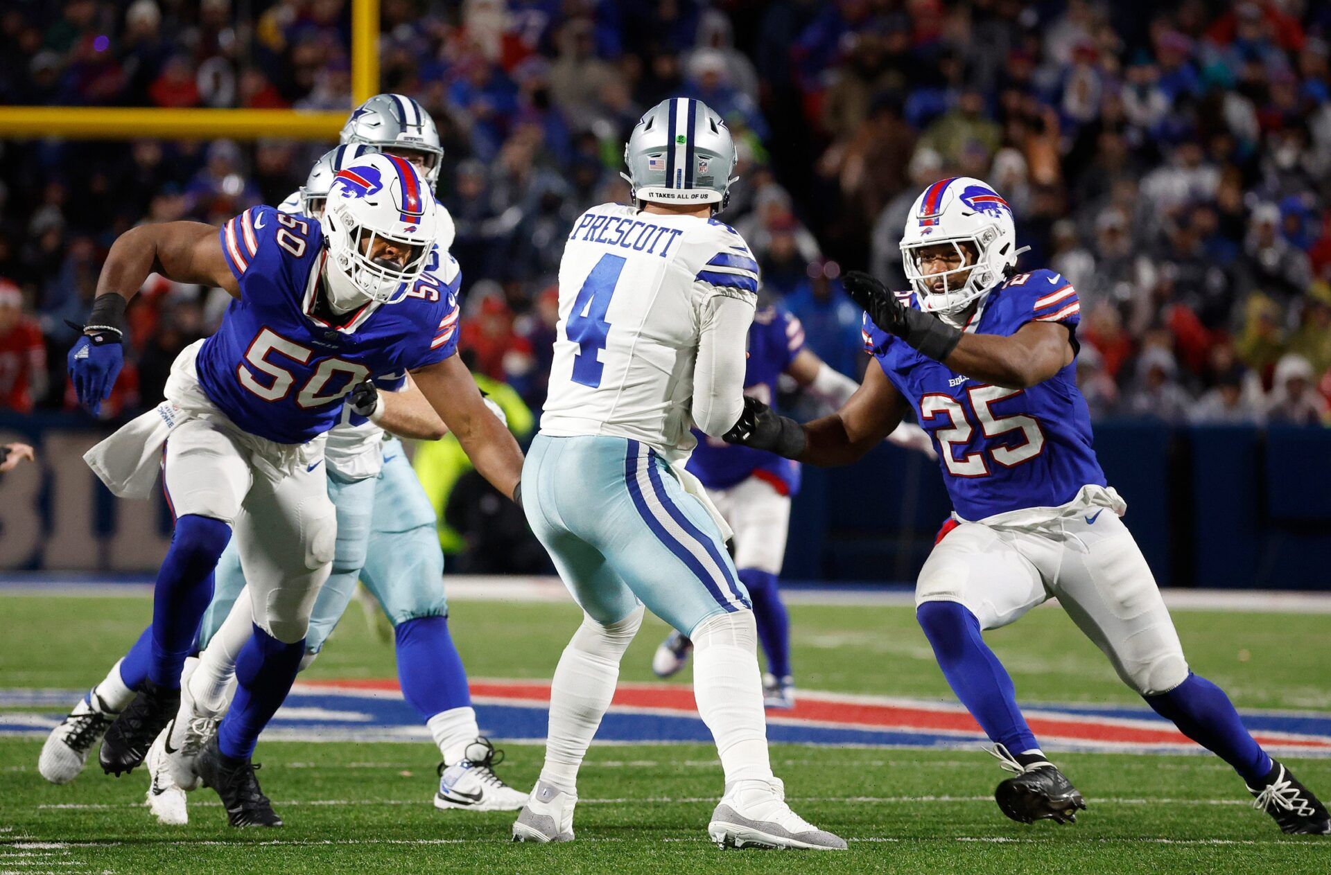 Buffalo Bills defensive end Greg Rousseau (50) and Buffalo Bills linebacker Tyrel Dodson (25) come together to suck Dallas Cowboys quarterback Dak Prescott (4).