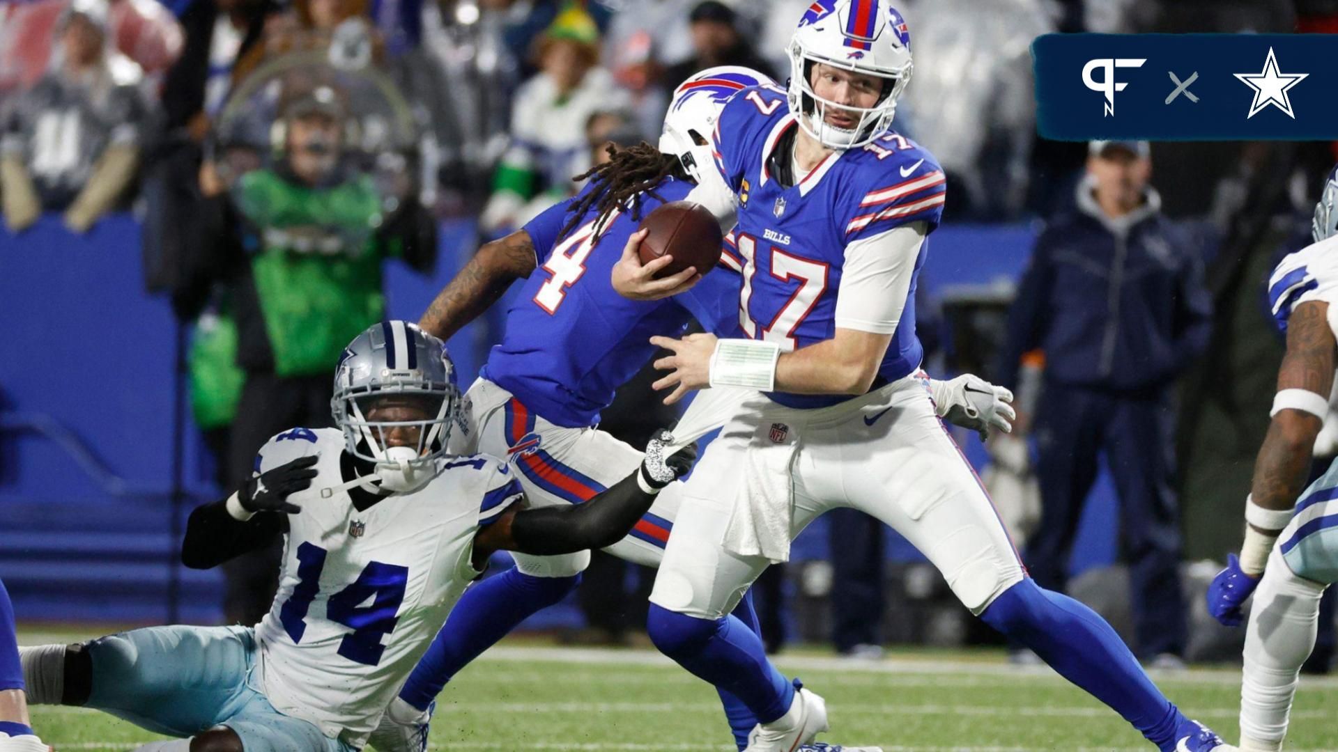 Buffalo Bills quarterback Josh Allen (17) breaks a tackle by Dallas Cowboys safety Markquese Bell (14).