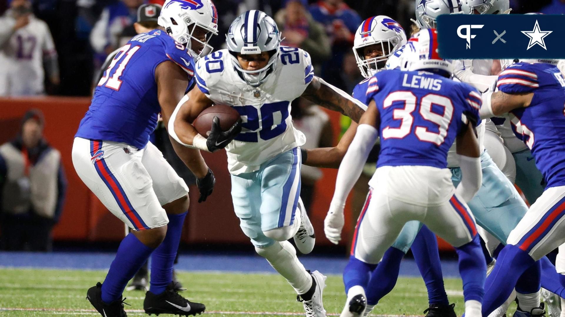 Dallas Cowboys running back Tony Pollard (20) finds a hole at the line of scrimmage.