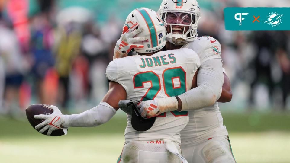 Miami Dolphins safety Brandon Jones (29) and LB Bradley Chubb (2) celebrate after an interception.