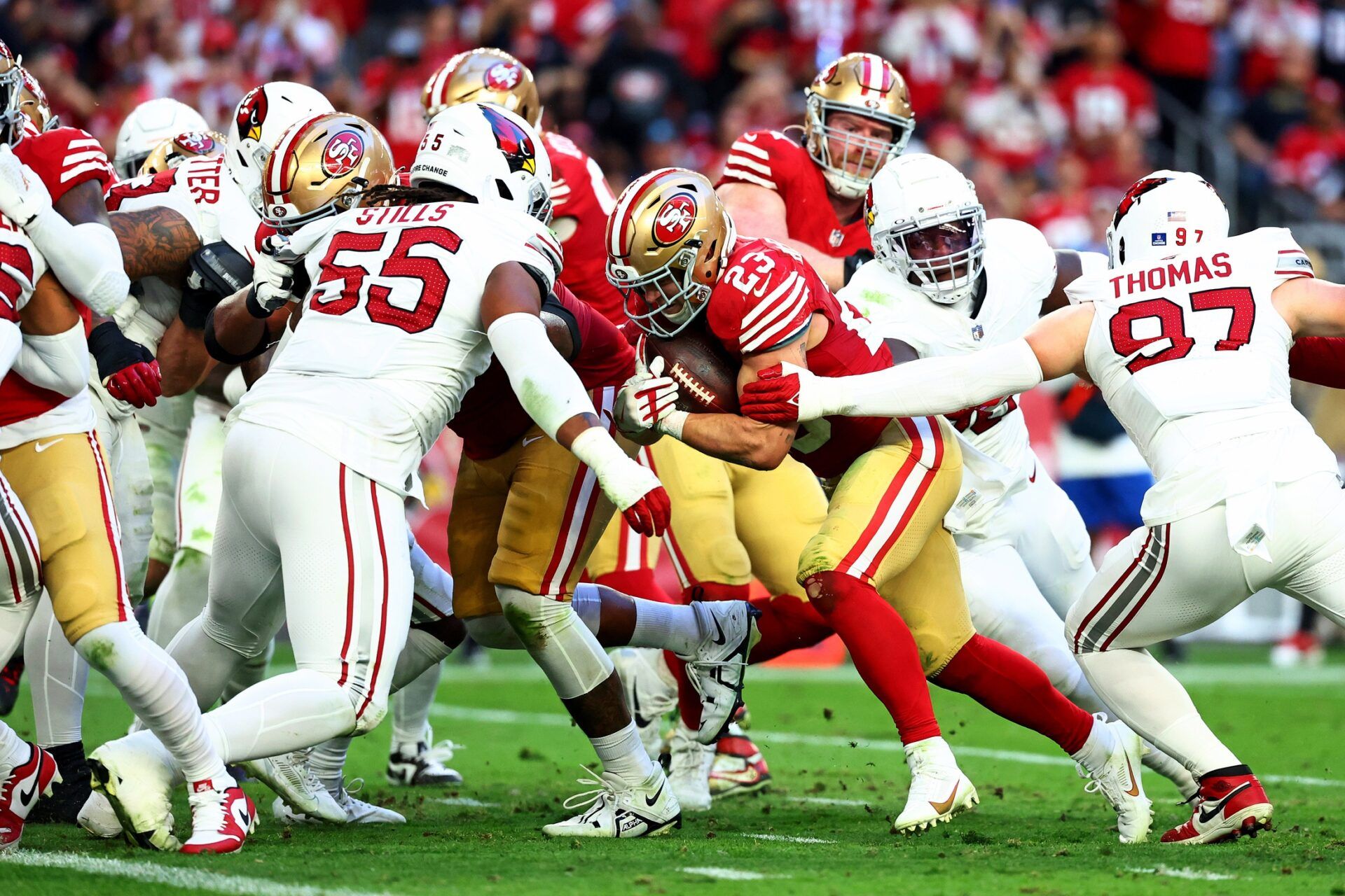 San Francisco 49ers running back Christian McCaffrey (23) runs the for a touchdown against the Arizona Cardinals at State Farm Stadium.