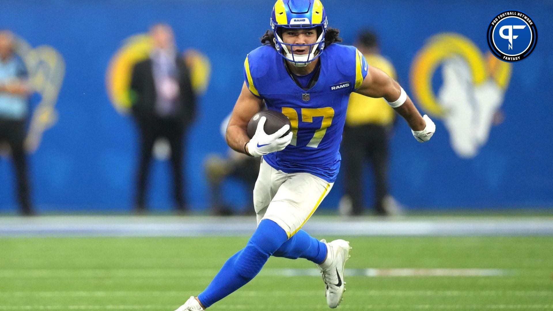 Los Angeles Rams wide receiver Puka Nacua (17) carries the ball against the Washington Commanders in the second half at SoFi Stadium.