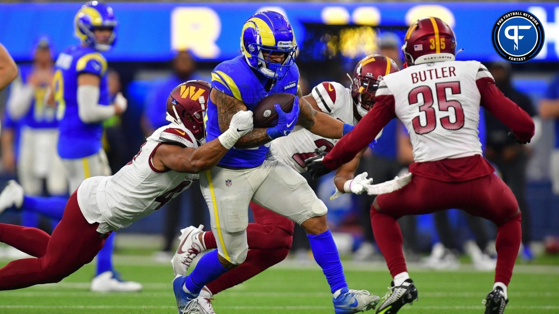 Los Angeles Rams running back Kyren Williams (23) runs the ball against the Washington Commanders during the second half at SoFi Stadium.