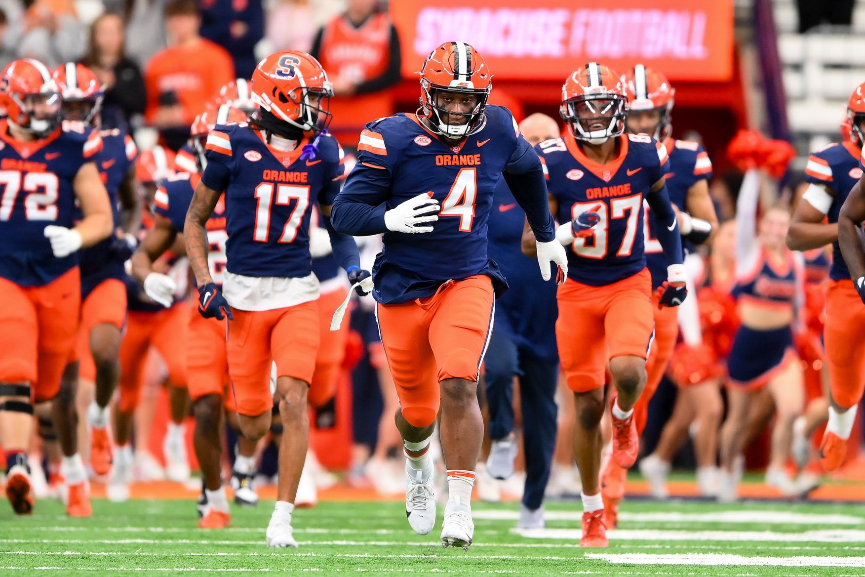 Syracuse Orange defensive lineman Caleb Okechukwu (4) leads his teammates on the field prior to the game against the Wake Forest Demon Deacons at the JMA Wireless Dome.