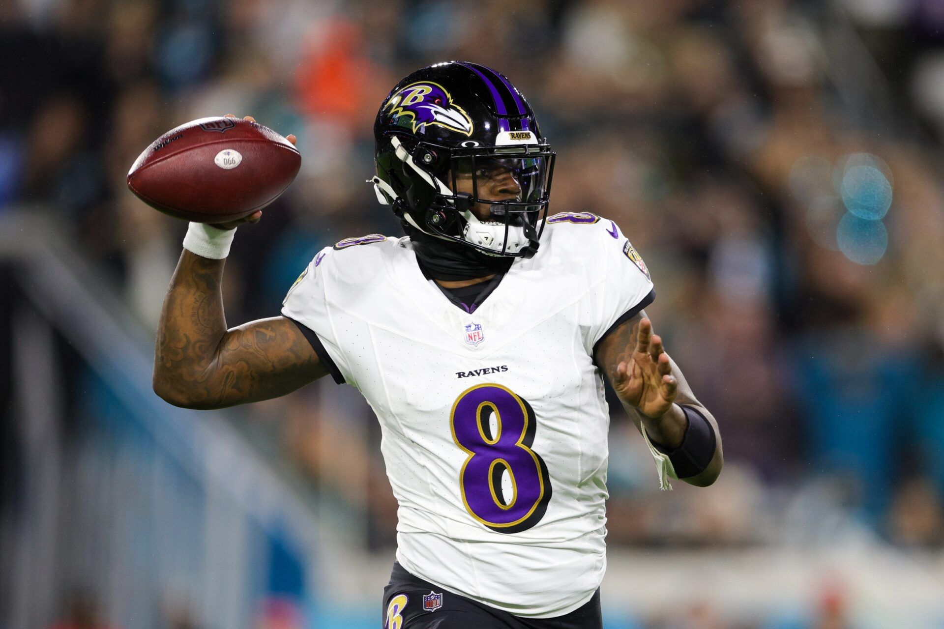 Baltimore Ravens quarterback Lamar Jackson (8) drops back to pass against the Jacksonville Jaguars in the first quarter at EverBank Stadium.