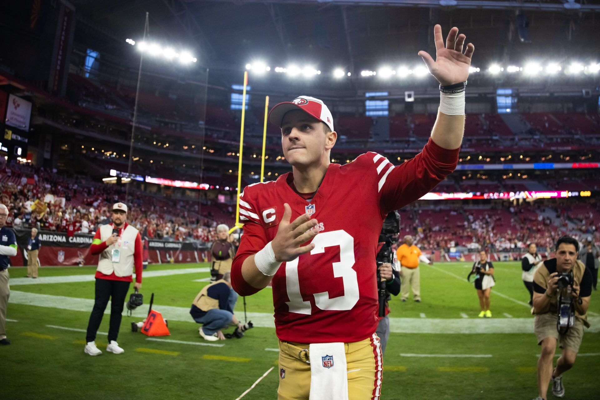 San Francisco 49ers quarterback Brock Purdy (13) celebrates following the game against the Arizona Cardinals at State Farm Stadium.