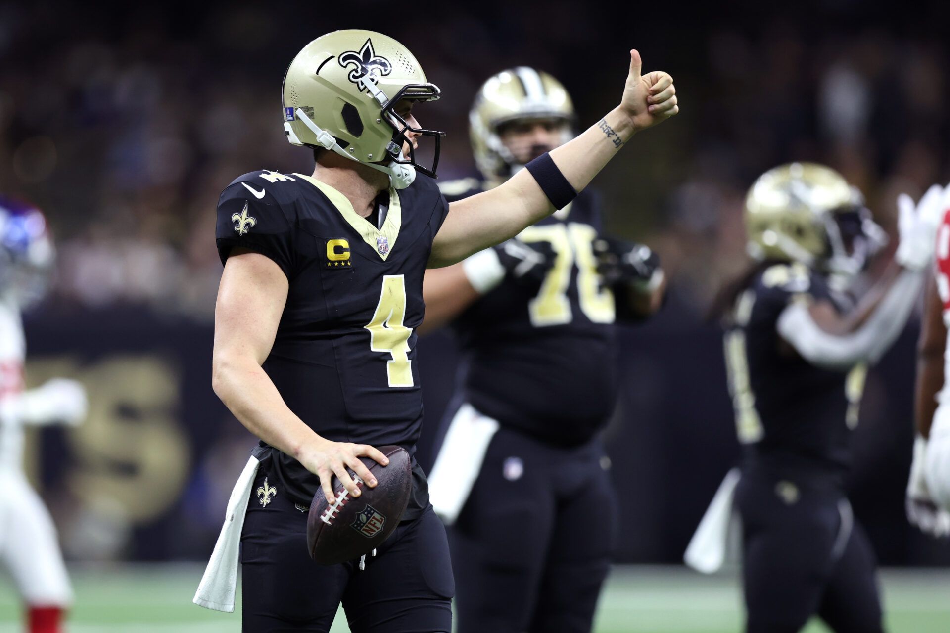 New Orleans Saints quarterback Derek Carr (4) gestures during the first half against the New York Giants at Caesars Superdome.