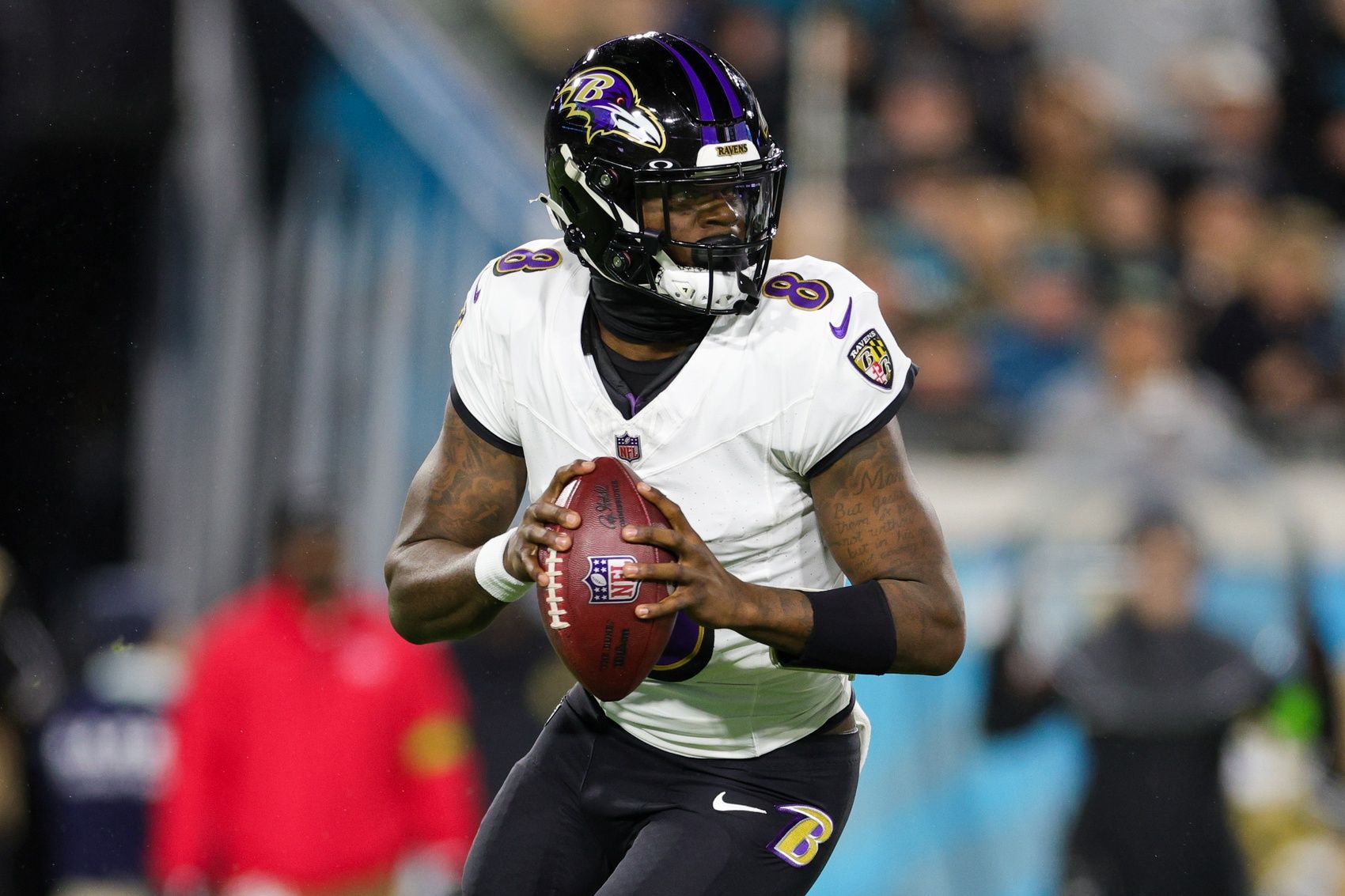 Baltimore Ravens quarterback Lamar Jackson (8) drops back to pass against the Jacksonville Jaguars in the first quarter at EverBank Stadium.