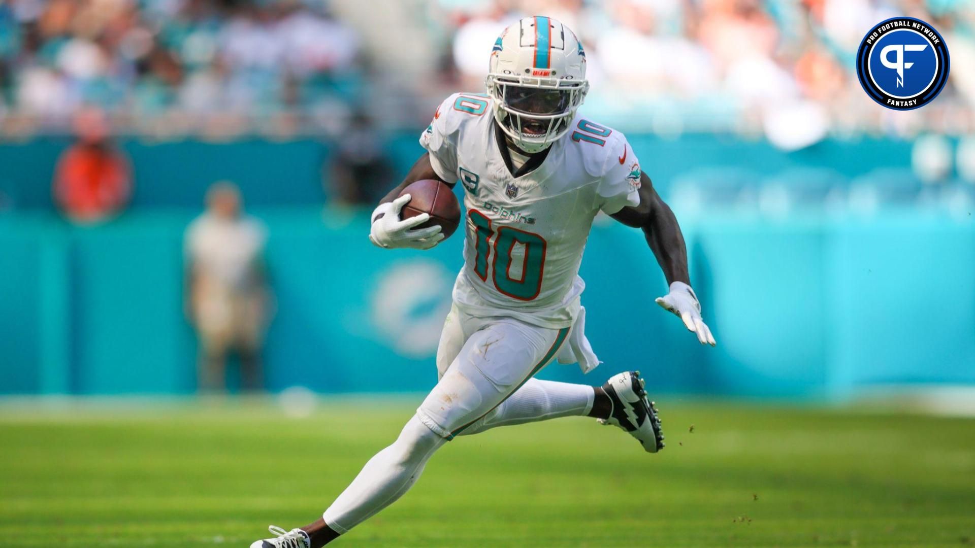 Miami Dolphins wide receiver Tyreek Hill (10) runs with the football against the Carolina Panthers during the second quarter at Hard Rock Stadium.