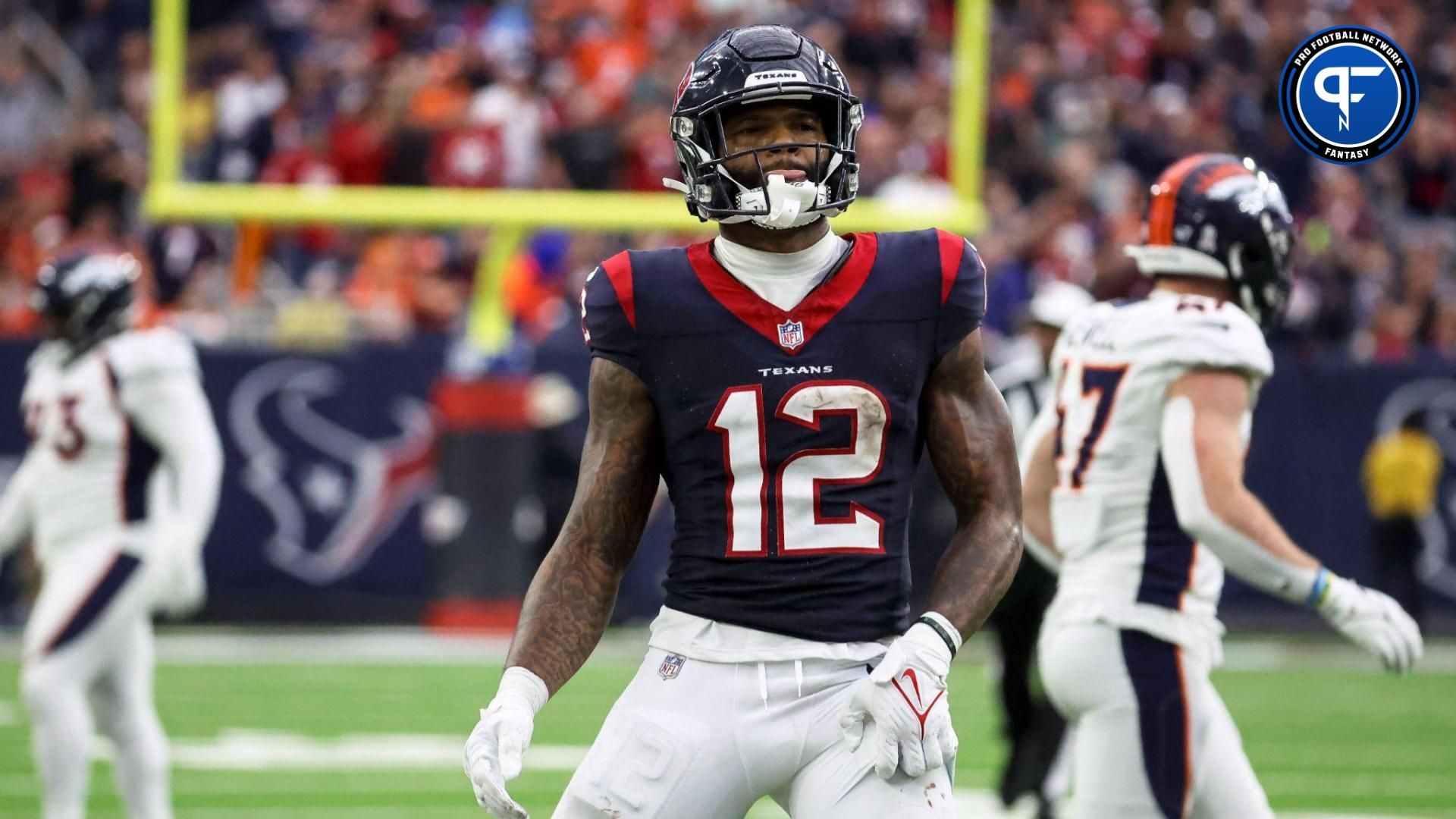 Houston Texans wide receiver Nico Collins (12) reacts after making a reception during the fourth quarter against the Denver Broncos at NRG Stadium.