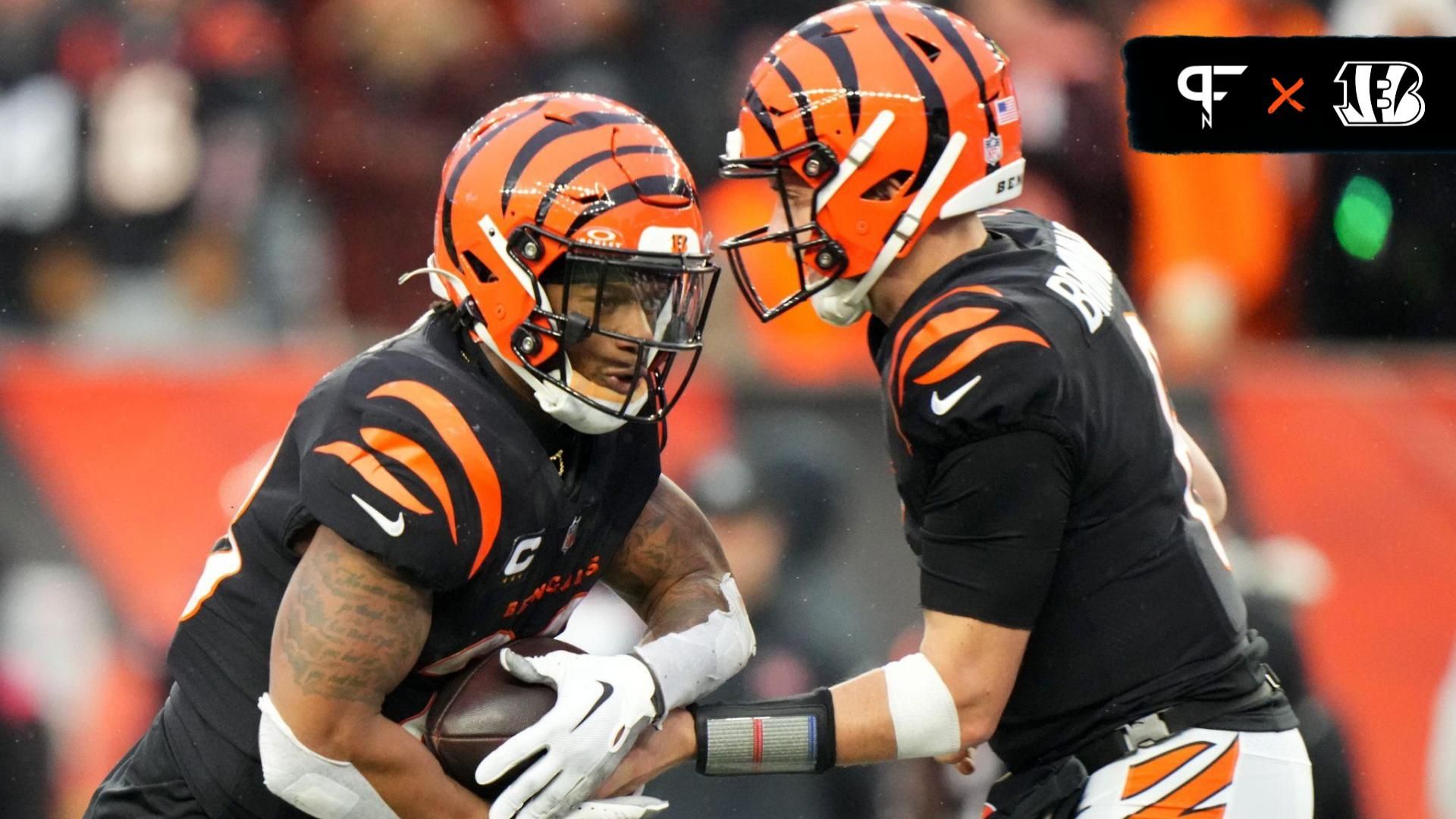 Cincinnati Bengals running back Joe Mixon (28) takes the carry from Cincinnati Bengals quarterback Jake Browning (6) in the fourth quarter during a Week 14 NFL game.