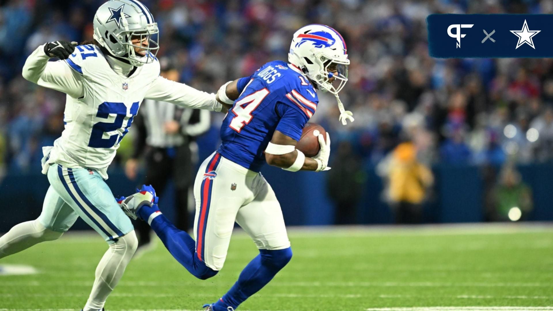 Buffalo Bills wide receiver Stefon Diggs (14) runs the ball pressured by Dallas Cowboys cornerback Stephon Gilmore (21) in the first half at Highmark Stadium.