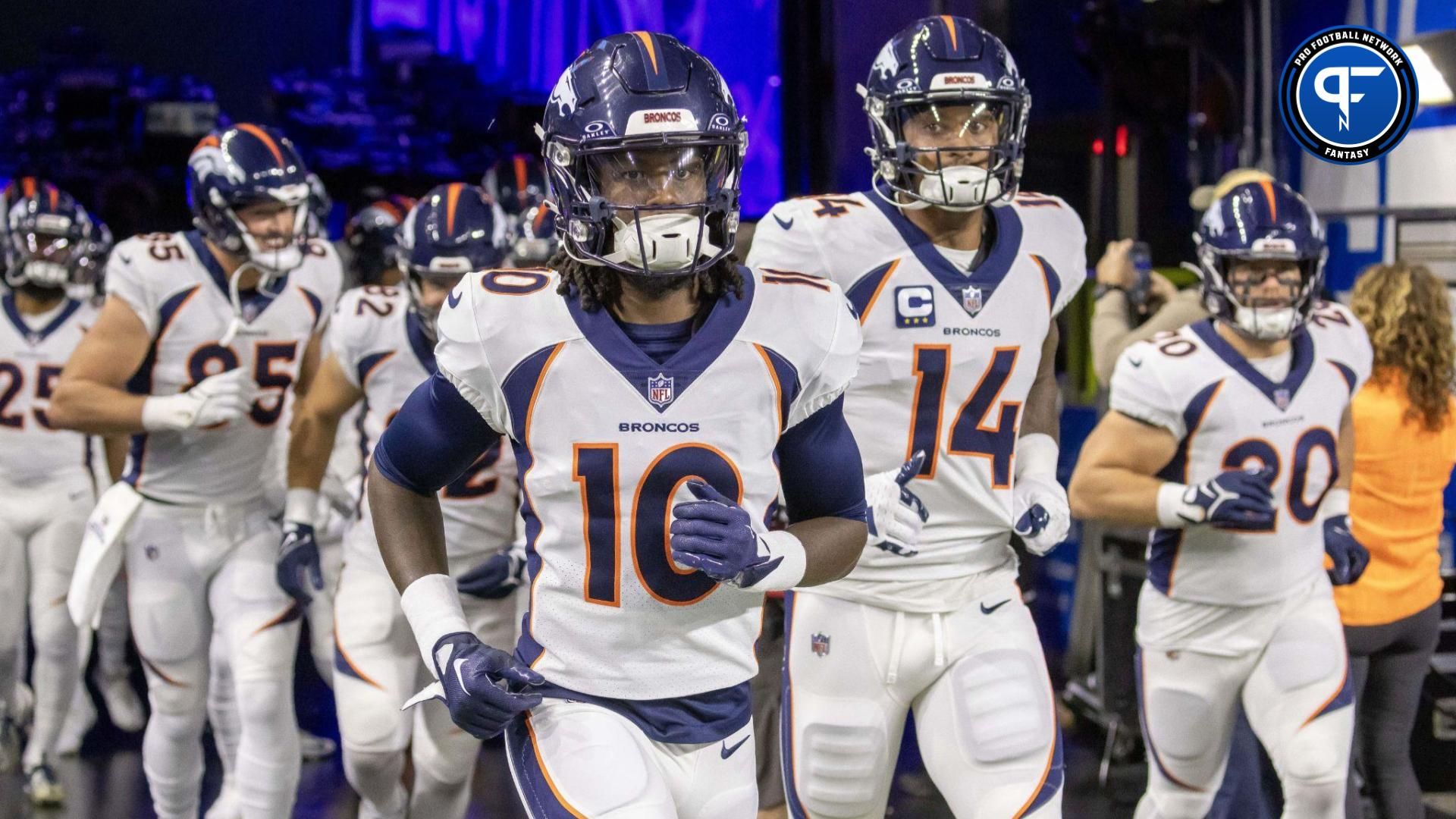 Denver Broncos wide receiver Jerry Jeudy (10) leads his team out for warm ups before the game against the Detroit Lions at Ford Field.