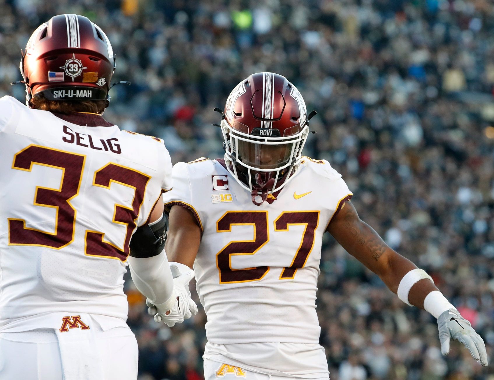 Minnesota Golden Gophers linebacker Ryan Selig (33) and Minnesota Golden Gophers defensive back Tyler Nubin (27) celebrate a defensive stop during the NCAA football game against the Purdue Boilermakers, Saturday, Nov. 11, 2023, at Ross-Ade Stadium in West Lafayette, Ind. Purdue Boilermakers won 49-30.