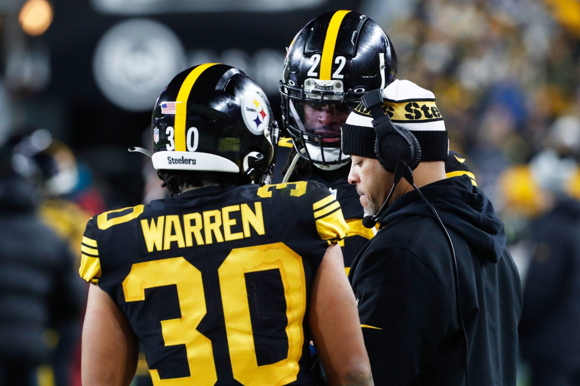 Pittsburgh Steelers running backs Jaylen Warren (30) and Najee Harris (22) talk with running backs coach Eddie Faulkner (right) on the sidelines against the New England Patriots during the third quarter at Acrisure Stadium.