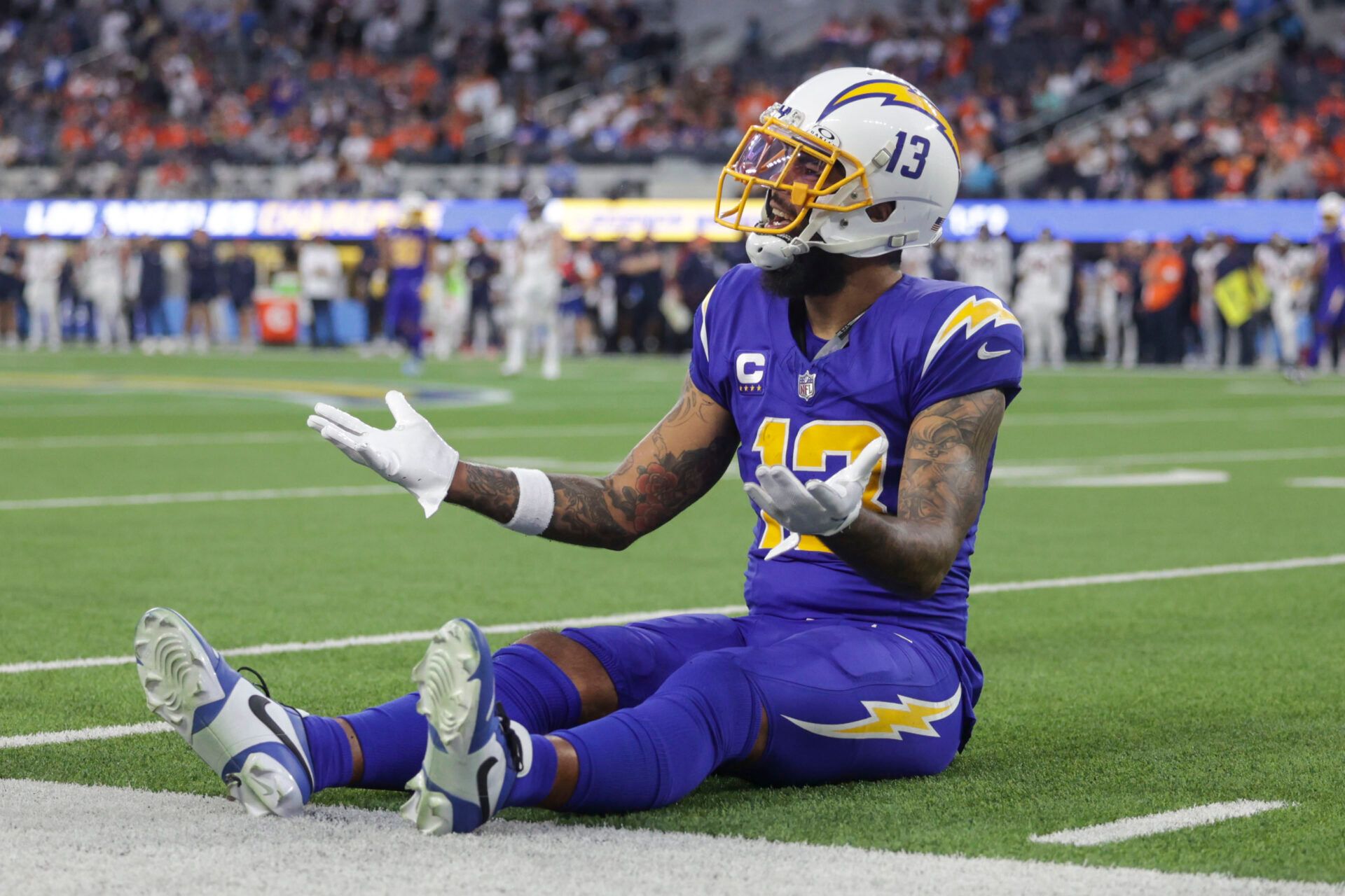 Los Angeles Chargers wide receiver Keenan Allen (13) singles to the referees during the second half in a game against the Denver Broncos at SoFi Stadium.