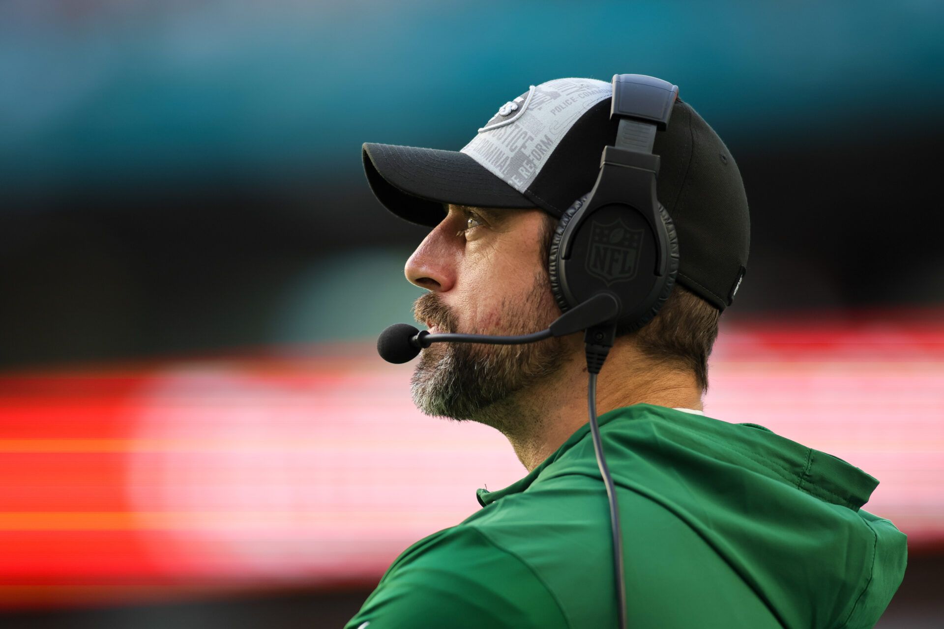 New York Jets quarterback Aaron Rodgers (8) looks on from the sideline against the Miami Dolphins during the fourth quarter at Hard Rock Stadium.