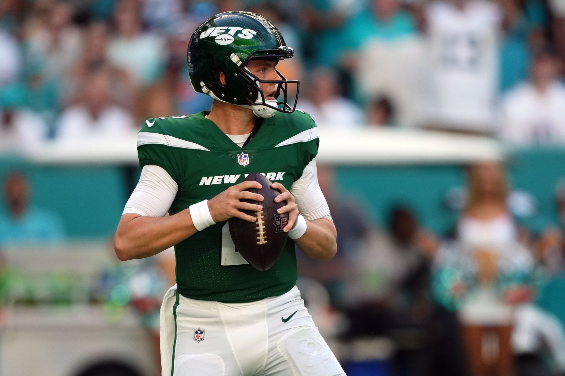 New York Jets quarterback Zach Wilson (2) drops back to attempt a pass against the Miami Dolphins during the first half at Hard Rock Stadium.