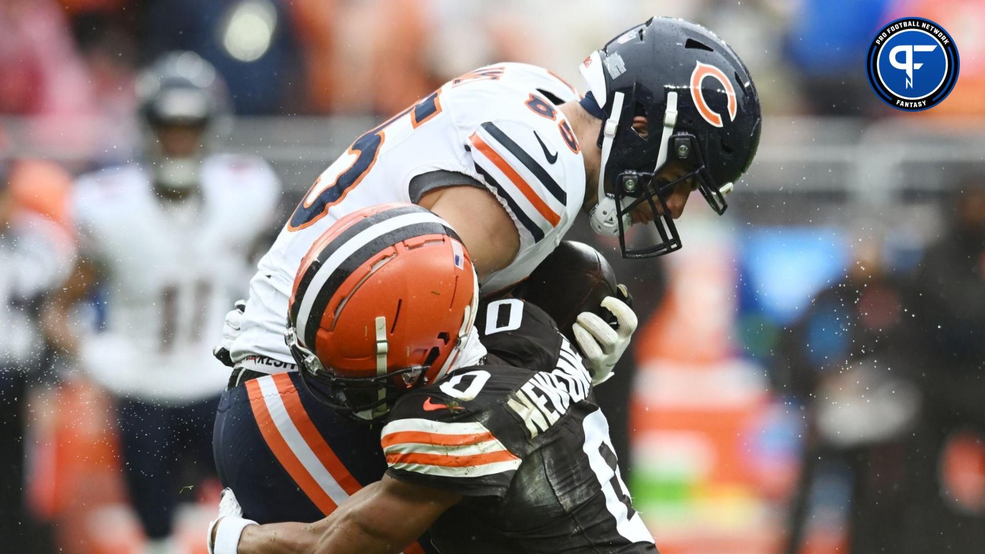 Cleveland Browns cornerback Greg Newsome II (0) tackles Chicago Bears tight end Cole Kmet (85) during the first quarter at Cleveland Browns Stadium.