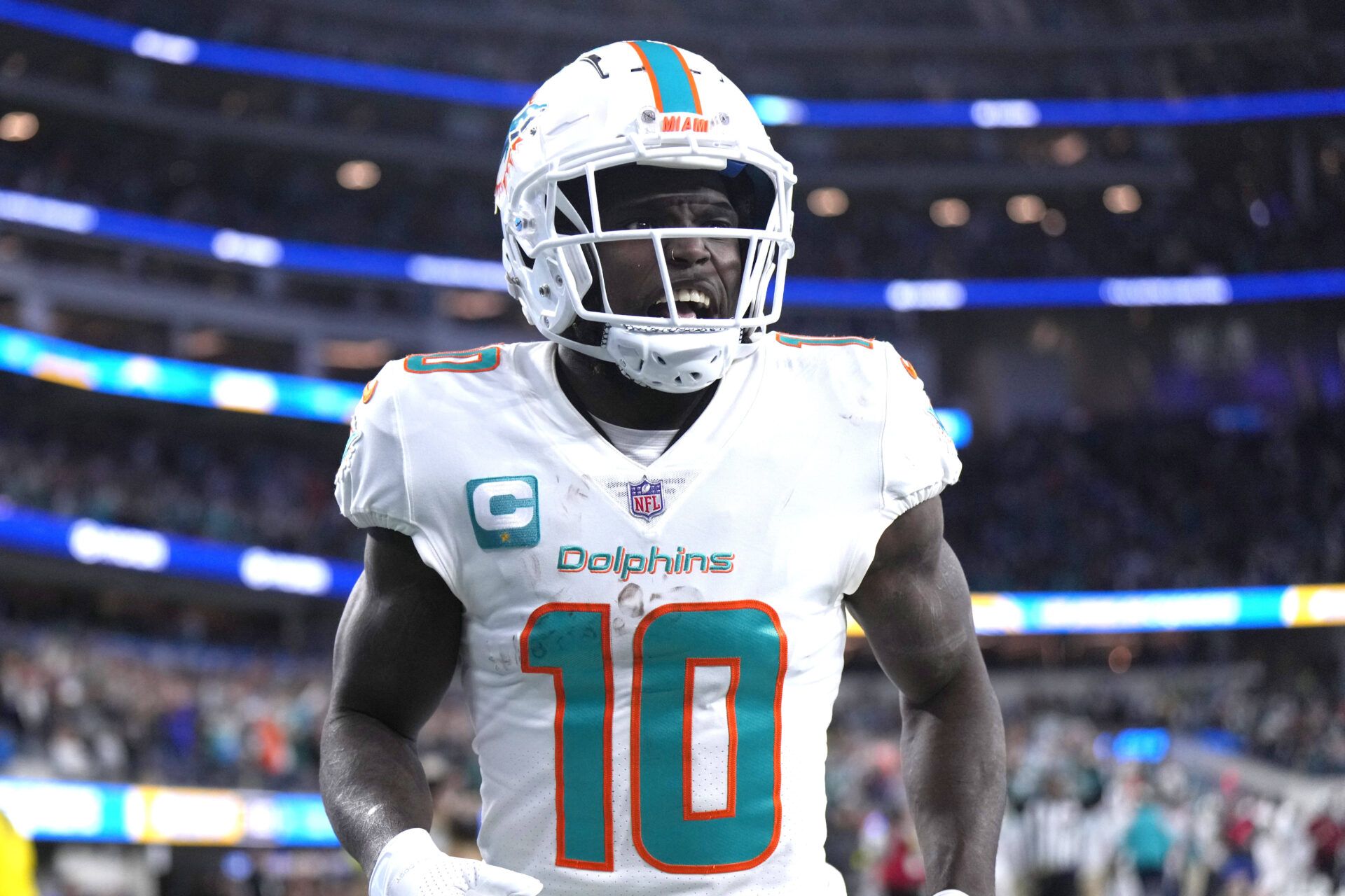 Miami Dolphins wide receiver Tyreek Hill (10) celebrates after scoring on a 60-yard touchdown reception in the second half against the Los Angeles Chargers at SoFi Stadium.