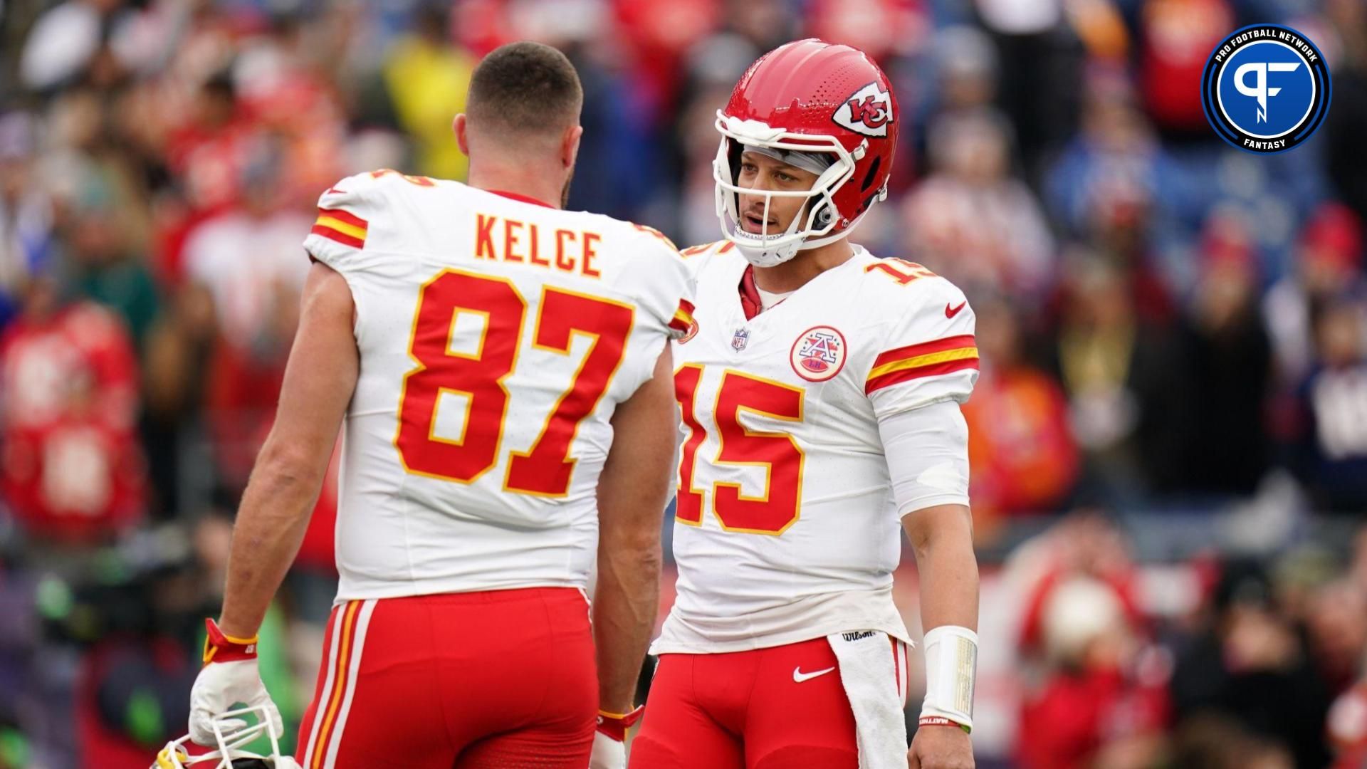 Kansas City Chiefs quarterback Patrick Mahomes (15) and tight end Travis Kelce (87) warm up before the game against the New England Patriots at Gillette Stadium.