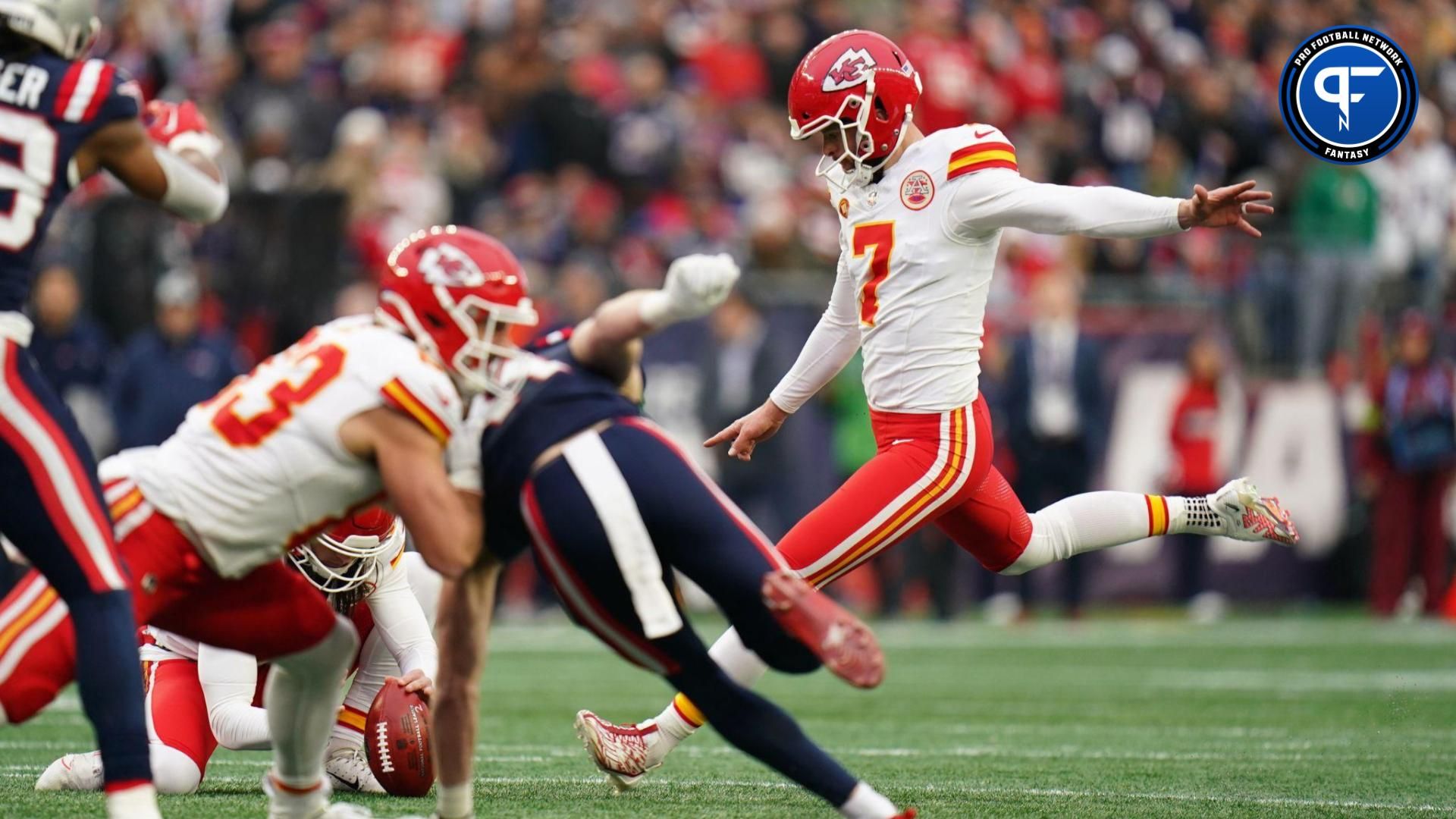 Kansas City Chiefs place kicker Harrison Butker (7) kicks the extra point against the New England Patriots in the first quarter at Gillette Stadium.