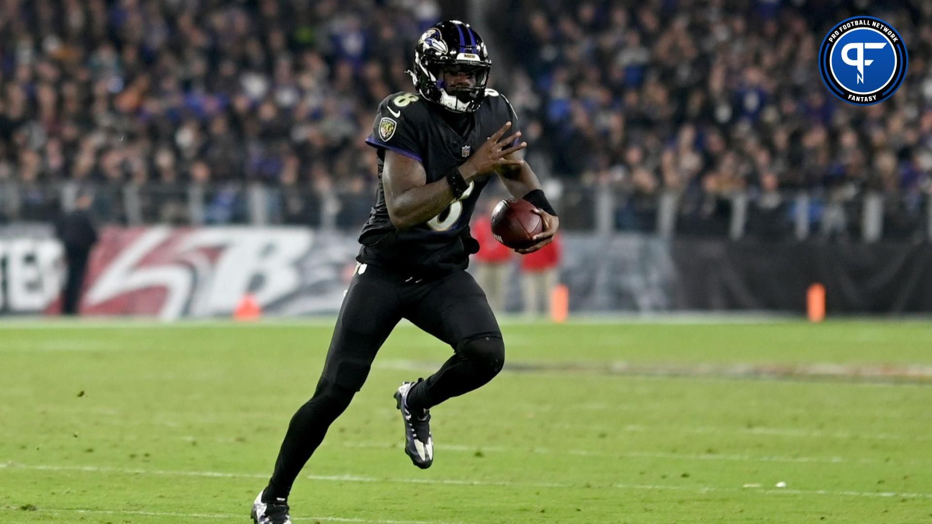 Baltimore Ravens quarterback Lamar Jackson (8) scrambles during the third quarter against the Cincinnati Bengals at M&T Bank Stadium.