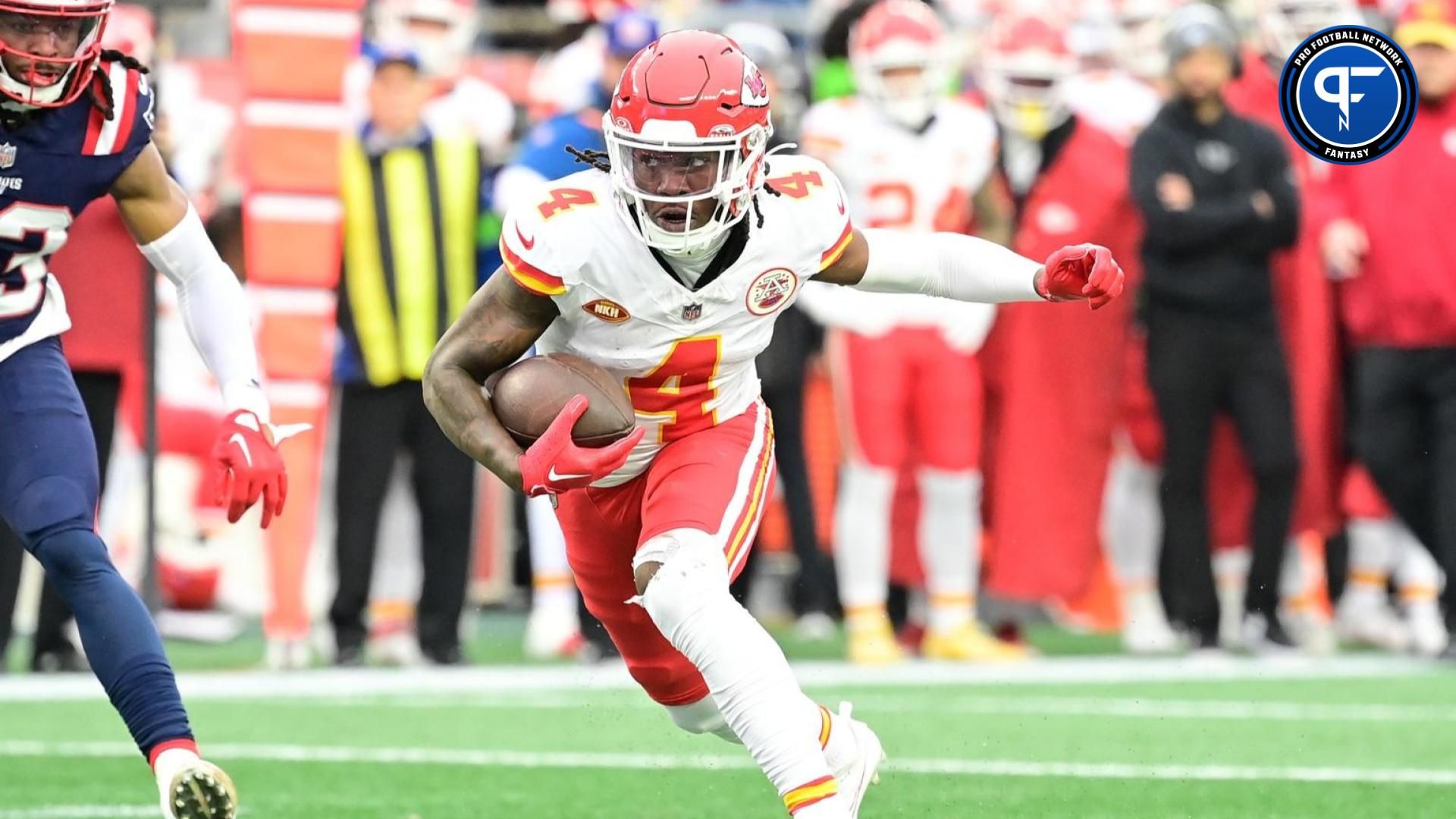 Kansas City Chiefs wide receiver Rashee Rice (4) runs the ball against the New England Patriots during the first half at Gillette Stadium.