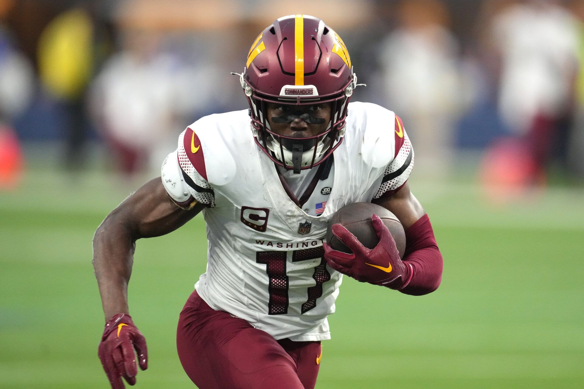 Washington Commanders wide receiver Terry McLaurin (17) carries the ball against the Los Angeles Rams in the second half at SoFi Stadium.