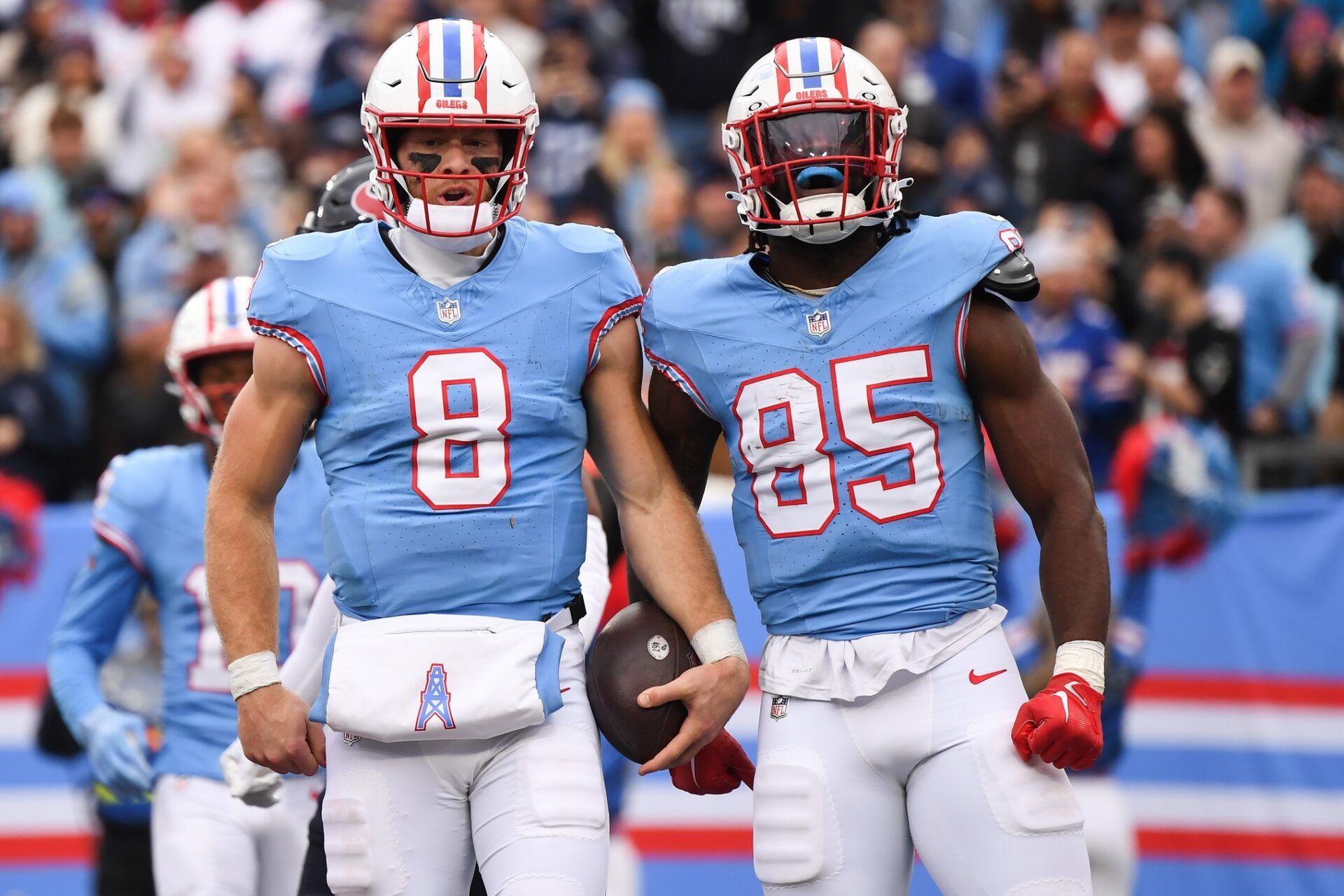 Tennessee Titans quarterback Will Levis (8) and tight end Chigoziem Okonkwo (85) celebrate after a touchdown during the first half against the Houston Texans at Nissan Stadium.