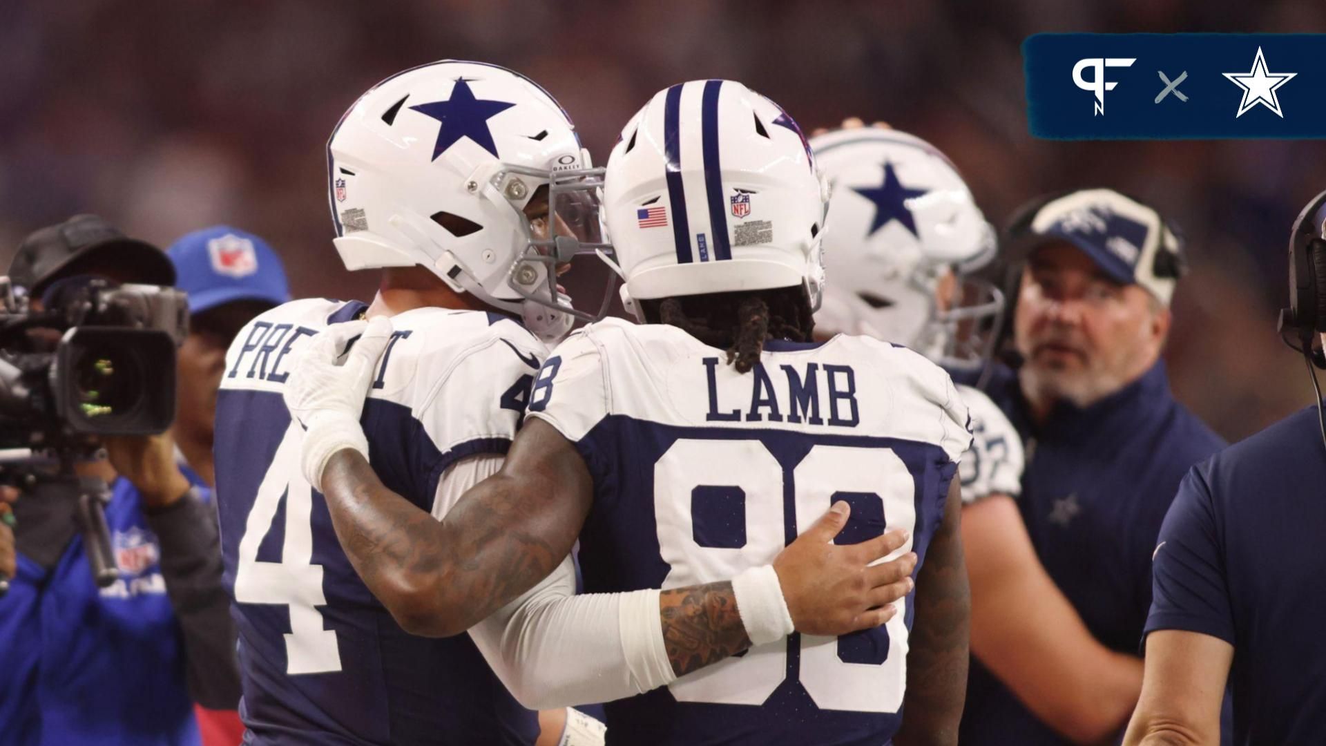 Dallas Cowboys wide receiver CeeDee Lamb (88) and quarterback Dak Prescott (4) talk during the game against the Washington Commanders at AT&T Stadium.