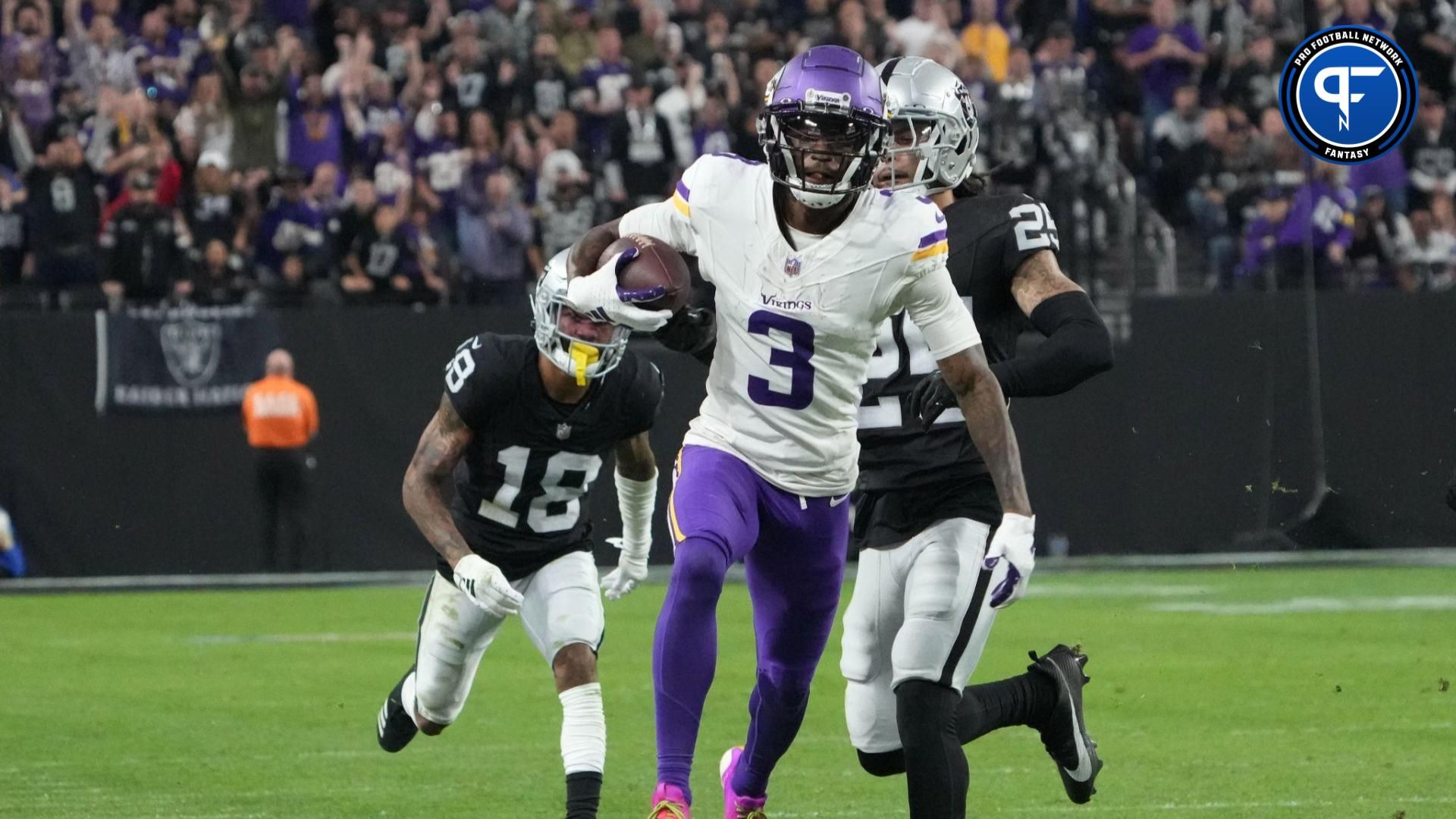 Minnesota Vikings wide receiver Jordan Addison (3) carries the ball against Las Vegas Raiders cornerback Jack Jones (18) in the second half at Allegiant Stadium.